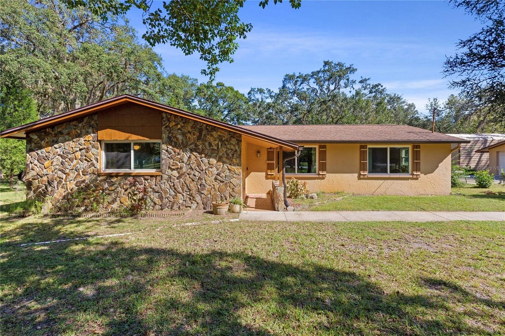 Photo of 10179 Frierson Lake Drive, Hudson, FL 34669 (MLS # TB8557891)