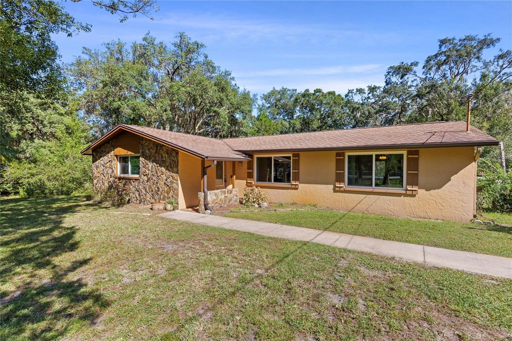 Photo of 10179 Frierson Lake Drive, Hudson, FL 34669 (MLS # TB8557891)