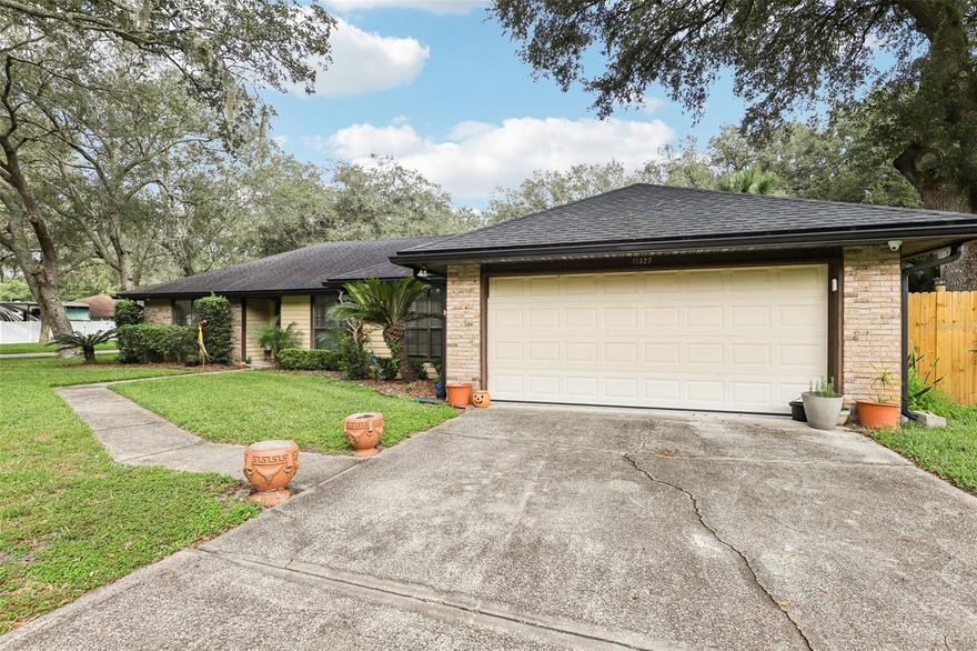 Tucked away on a quiet street this beautiful BRICK accented home perfectly situated on a CORNER LOT is ready for you to call HOME! Great neighborhood with NO HOA & a public park (1/4 mi) just down the street. You will be welcomed by tile floors throughout the main areas including a flex space (perfect for an office, play area, or sitting room), formal dining & living room complete with fireplace.  Well-appointed kitchen with GRANITE counters & stainless-steel appliances.  Wait until you see the SUNROOM an additional 240 sq ft of natural light (NEW window AC unit to be installed prior to closing) creating the perfect space to enjoy your morning coffee or read a book while the pups or kids play in your FENCED yard.  Video security system installed, just needs to be hooked up for monitoring. Convenient location 8 mi to NS Mayport & St Johns Town Center, 10 mi to the Beach & 1 mi to Ed Austin Park.  Tenant is moving out at the beginning of Nov 2025.  Roof 2019.  This is a must see!