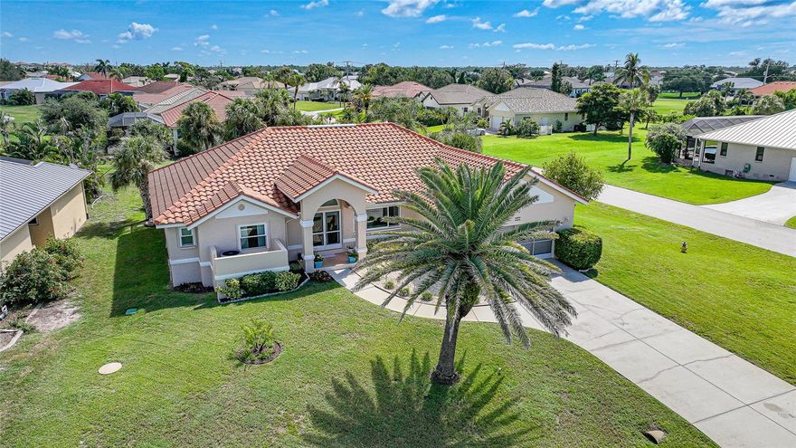 Stunning HEATED & COOLED POOL home on an oversized corner lot in the highly sought after Cape Haze Windward community. Appraised at $525,000 in October 2024.

This beautifully updated 2-bedroom, 2 bath residence with a bonus room—ideal as an OFFICE or THIRD BEDROOM—offers the perfect balance of elegance, comfort, and Florida lifestyle. Enjoy tranquil peek-a-boo views of the pond and golf course in a home designed for both relaxation and entertaining.

The double door entry welcomes you into a bright open concept great room with soaring 11.5 ft vaulted ceilings, crown and chair rail molding, and neutral coastal tones. Four pocketing sliding glass doors open seamlessly to the expansive screened lanai, where a heated and cooled pool, covered seating areas, and a 64 foot enclosure create a private resort style retreat.

The designer kitchen is a centerpiece, featuring granite countertops, rich wood cabinetry, FINGERPRINT RESISTANT stainless appliances (2019), a breakfast bar, and a cozy dining nook overlooking the pool. A convenient pass through window enhances outdoor dining and entertaining.

The primary suite is a peaceful retreat with a large walk-in closet, additional built in storage, and a sitting area or work out equipment area with direct pool access. The ensuite bath offers dual vanities, a makeup station, soaking tub, and walk-in shower with FLOOR TO CEILING  tile. The guest suite includes a walk-in closet, private sitting area, and access to the pool, with the guest bath also serving as a convenient pool bath.

Additional highlights include HURRICANE IMPACT WONDOWS (2018), laminate flooring in main living areas, an interior laundry room with utility sink, and an oversized two-car garage with sliding screen panels.

Located minutes from The Links Golf Course, Don Pedro Island State Park, grocery stores, and restaurants. Residents enjoy quick access to beaches, boating, and world-class fishing at Boca Grande. Boca Grande Causeway is approximately 3 miles away, and Englewood Beach is less than 10 miles.

This home offers a rare combination of quality, comfort, and location—ideal for year-round living, a seasonal retreat, or a luxury investment property.