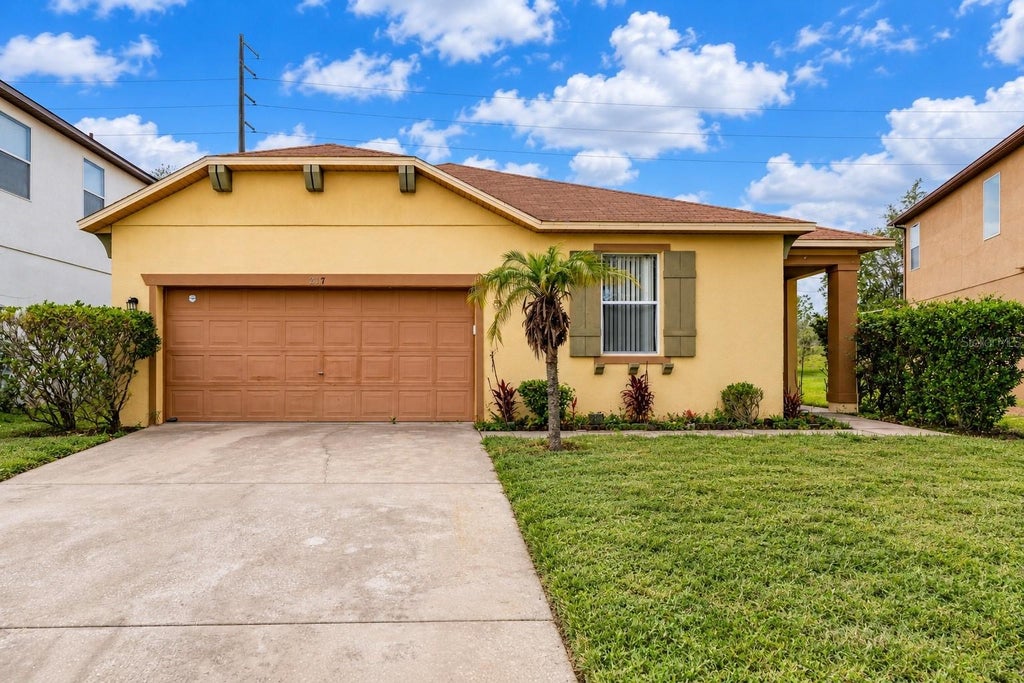 Photo of 217 Sand Ridge Drive, Davenport, FL 33896 (MLS # TB8547124)