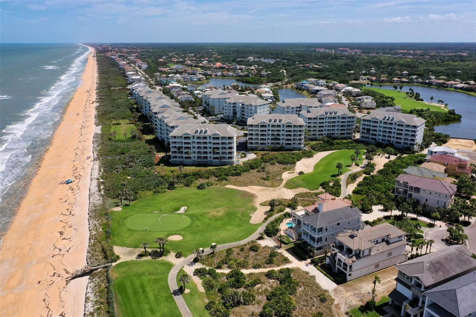 Sea, sand & surf—welcome to your turnkey coastal escape. This fully furnished 5th-floor Cinnamon Beach residence frames sweeping Atlantic vistas and golf views over the 8th hole of the Jack Nicklaus Ocean Course from an expansive tiled balcony with room for al-fresco dining, chaise lounges, and morning coffee with the ocean breeze. Inside, a light, open plan with volume ceilings complements a well-appointed kitchen featuring 42" cabinetry, granite counters (kitchen & baths), and stainless steel appliances. Thoughtful upgrades include newer carpet, in-unit washer/dryer, and major mechanical peace of mind: HVAC 2025 and water heater 2020.
Sold fully furnished, the condo is currently in a short-term rental program with steady monthly revenue—keep it producing or enjoy it as your own coastal retreat. Cinnamon Beach’s amenity set is resort-style and effortless: oceanfront & zero-entry pools, two hot tubs, kids’ splash park, billiards, game room, café, fitness center, and beach walkovers to those signature cinnamon-hued sands. This is the beach life—made easy.