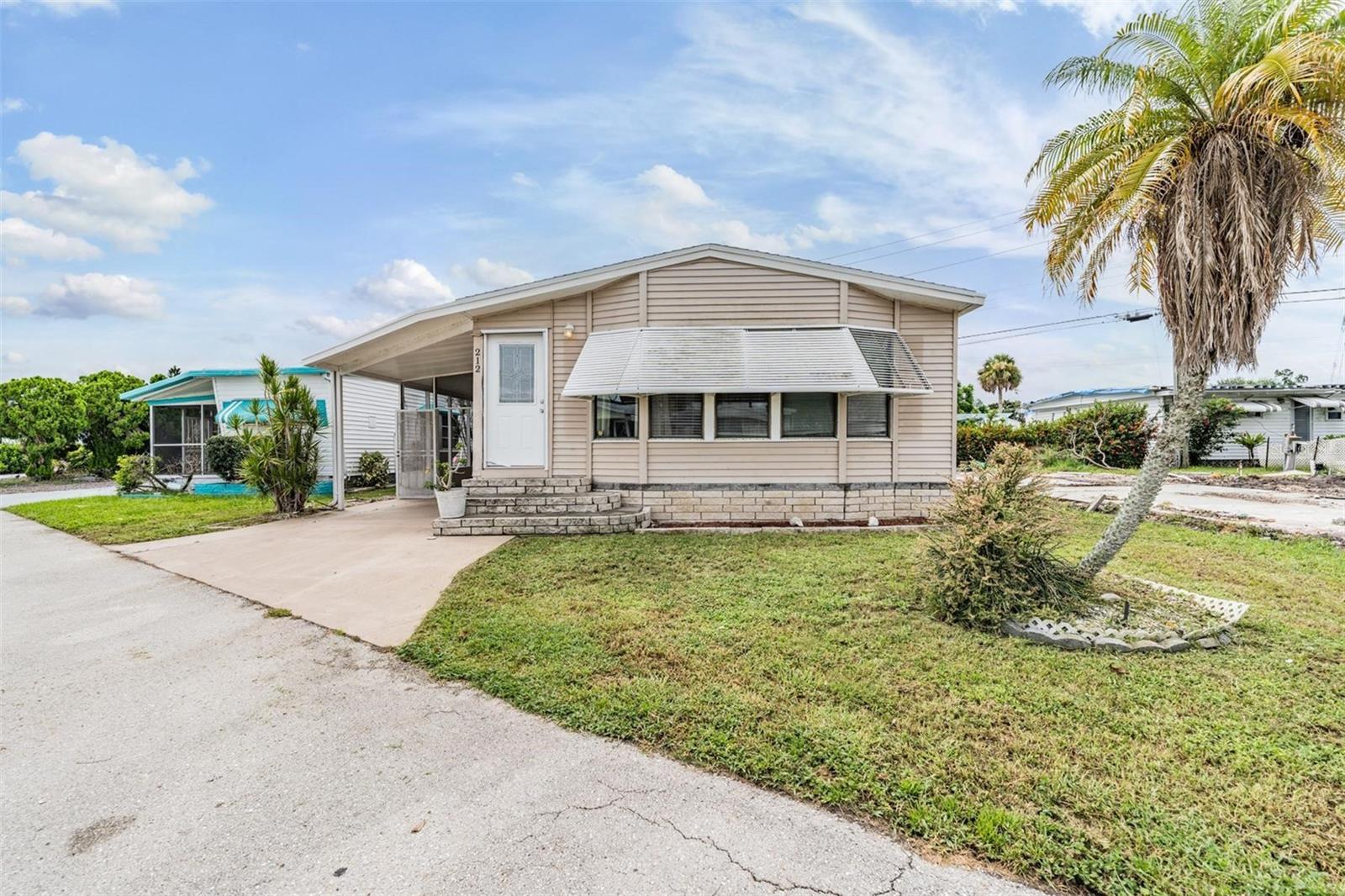 Charming 2-Bedroom, 2-Bath Home in a Prime Bradenton Location – All Ages Welcome, Owned Land & Insurable Property!
Welcome to this beautifully maintained 2-bedroom, 2-bath home offering 1,228 sq ft of comfortable living space in the heart of Bradenton. Step inside to find a light and inviting interior, where the kitchen provides all the essentials with quality appliances and ample counter space, making meal preparation a breeze. The home’s thoughtful layout ensures comfort and privacy, with a spacious primary suite, a well-sized second bedroom, and two full bathrooms. The living areas flow seamlessly, creating the perfect setting for everyday living or hosting guests.
Outside, enjoy the peace of your own space on owned land with the confidence of an insurable property, all while being just minutes from Bradenton’s best attractions—white sandy beaches, the scenic Riverwalk, lush parks, shopping, dining, and cultural spots. Situated in a community where all ages are welcome, you’ll have the flexibility to make this home fit your lifestyle. Whether you want to relax at home or explore the vibrant surroundings, this property offers the best of both worlds. Don’t miss your chance to own a move-in-ready home in a desirable location—schedule your showing today!