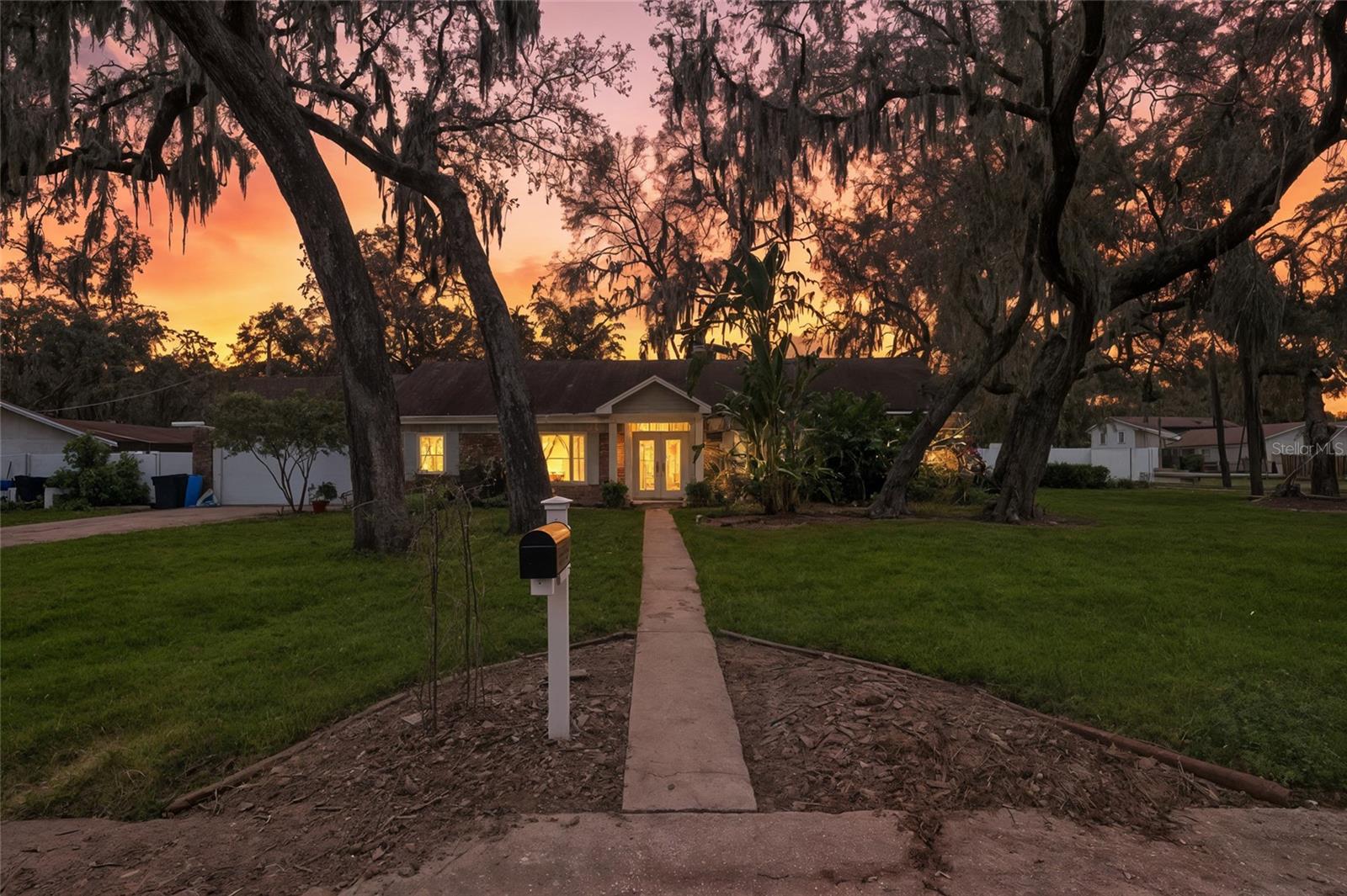 Charming Corner Lot Home with Poolside Paradise | 3 Bed | 2 Bath | Oversized Garage | Heated Pool | No HOA No CDD
Welcome to your Florida dream home! This charming 3-bedroom, 2-bathroom residence sits on a beautifully maintained 0.40-acre corner lot in a well-established neighborhood with no HOA. From the moment you arrive, you’ll appreciate the curb appeal and spacious layout that has both comfort and the ultimate indoor-outdoor lifestyle. Inside, the home features real wood flooring, a formal living room, a separate dining area, and a spacious family room that flows seamlessly into the kitchen. A glass door off the family room leads to a screened-in porch and a sparkling heated pool, creating the perfect space for relaxing or entertaining year-round.
The home’s split-bedroom layout includes three generously sized bedrooms and two full bathrooms. The primary suite offers a handicap-accessible shower, while the hall bath includes dual closets for added storage and convenience. Additional features include hurricane-impact windows, a water softener system, and an oversized garage with a separate washer and dryer area. A double gate provides access for storing a boat, trailer, or recreational toys, and the backyard is a true retreat, complete with a greenhouse and enclosed by a classic vinyl privacy fence, surrounded by lush landscaping and mature tropical trees.
The heated pool was resurfaced in 2021 and features a new pump, making it ready for year-round enjoyment. Best of all, with no HOA, no CDD you have the freedom to truly make this home your own. The seller is also open to replacing the roof or offering a credit at closing with acceptable terms—the current roof has no leaks but is older. Don’t miss this opportunity to own a slice of paradise!