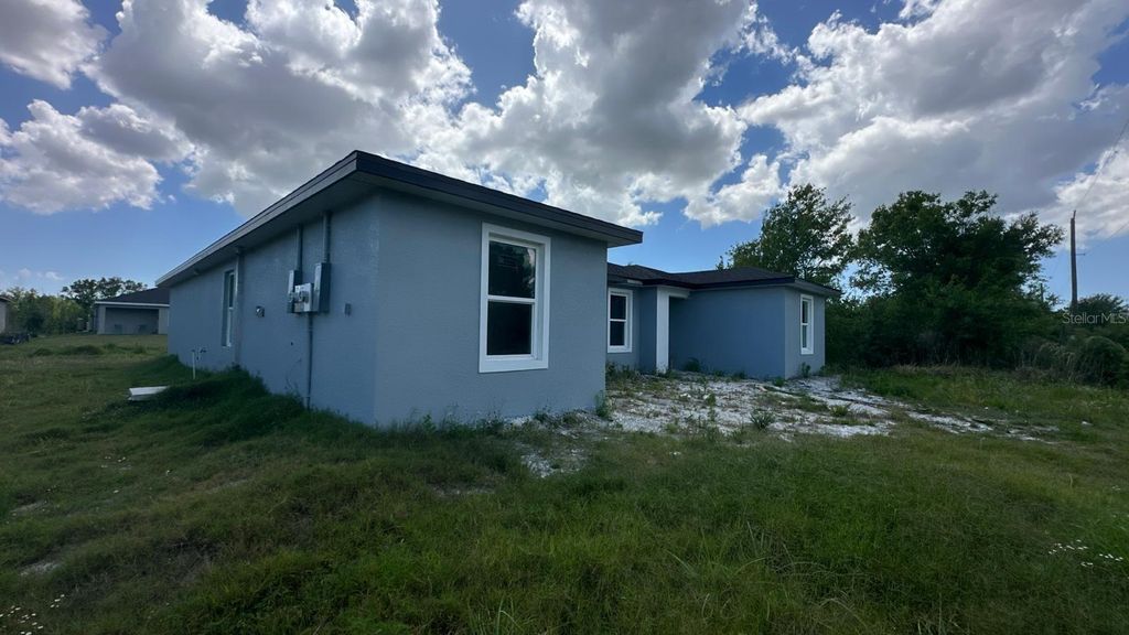 Photo of 12223 Kirk Avenue, Port Charlotte, FL 33981 (MLS # TB8429145)