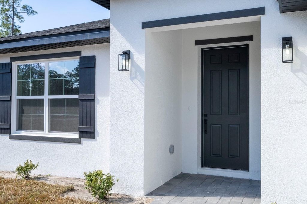 Photo of 2434 Amnesty Drive, North Port, FL 34288 (MLS # O6406005)