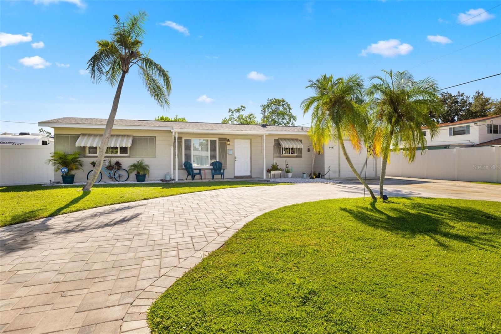 Resort-style living awaits in this beautifully updated 3-bedroom + BONUS ROOM, 2-bath, 1,419 sq ft POOL home in a desirable NON-FLOOD zone. Designed for both comfort and entertaining, the home welcomes you with an open floor plan where the living, dining, and kitchen spaces flow seamlessly together. Two expansive sets of sliding glass doors flood the interior with natural light and lead out to a private backyard oasis—complete with a sparkling pool, raised deck with hot tub, outdoor shower, and detached covered patio. The primary and secondary bedrooms each feature sliders overlooking the pool, blending indoor and outdoor living, while a versatile bonus room offers flexibility for a home office, gym, or media room. A separate laundry room adds convenience and functionality. Throughout the home, ceramic tile floors add a clean, modern touch and enhance the open, airy feel. Thoughtful updates provide peace of mind, including a new roof (2020), HVAC (2020) with the last service completed in June 2025 along with the installation of a new UV light, hurricane-rated Jeld-Wen sliding doors (2017 & 2019), resurfaced pool (2021), and a brand-new circular driveway (2024). Ample storage and outdoor living features make this home as functional as it is inviting. Perfectly located just minutes from downtown St. Petersburg’s vibrant dining, arts, and waterfront parks, with convenient access to Tampa International Airport and the Gulf beaches, this property offers the very best of Florida living.