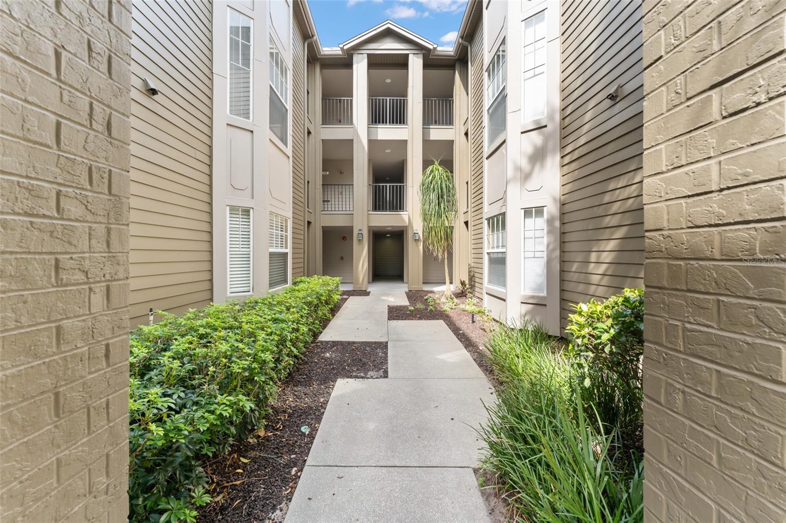 **This property qualifies for a closing cost credit up to $3,700 through the Seller’s preferred lender.**Look no further than this beautifully maintained second-floor condo located in the gated community of The Residences at Sabal Point. This spacious 3-bedroom, 2-bathroom unit offers a functional and inviting layout. Step through the front door to find a galley-style kitchen with granite countertops, stainless steel appliances, and a cozy dinette nook tucked at the back—complete with a laundry closet behind bifold doors. The kitchen also features a convenient pass-through window into the living room, creating an open, connected feel. Just off the living room, enjoy your private screened-in balcony—perfect for morning coffee or evening relaxation. Down the hallway are three generously sized bedrooms and two full bathrooms, including the primary suite at the rear of the unit with a large ensuite featuring a double sink vanity and a stand-up shower. This property offers flexibility as a primary residence or investment opportunity, with a tenant currently in place through 6/30/2026. The community provides resort-style amenities including tennis courts and a stunning pool overlooking a tranquil pond with a fountain—all within a secure, gated setting. Experience comfort, convenience, and income potential in this sought-after Longwood location. Schedule your private showing today!