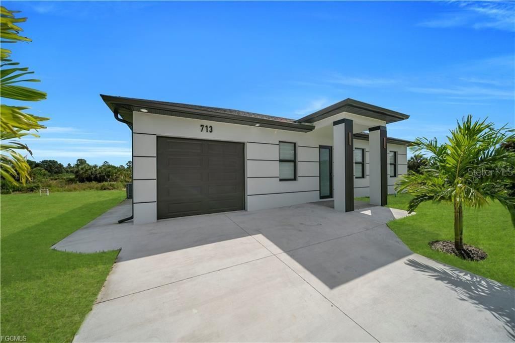 Photo of 713 Roma Avenue S, Lehigh Acres, FL 33974 (MLS # A4668902)