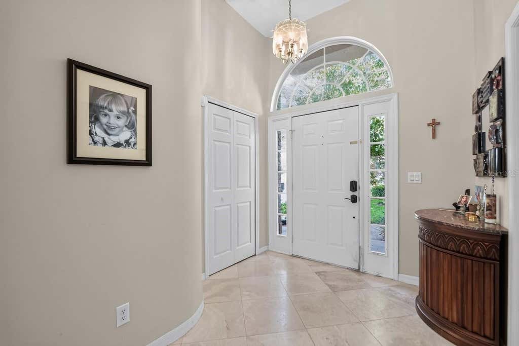 Photo of 7691 Belvoir Drive, Orlando, FL 32835 (MLS # O6435100)