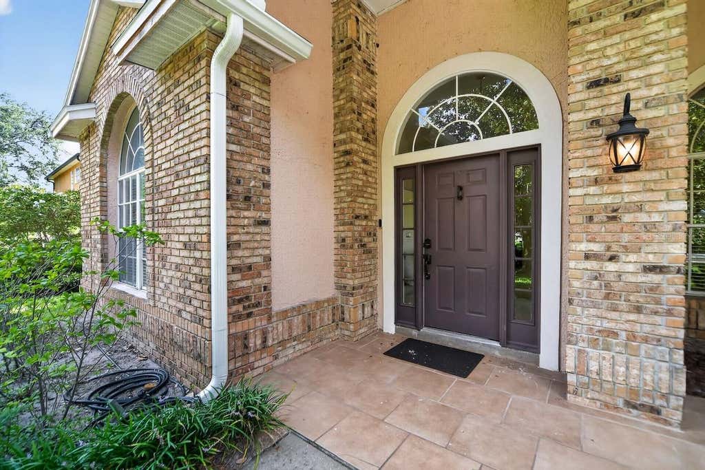 Photo of 7691 Belvoir Drive, Orlando, FL 32835 (MLS # O6435100)