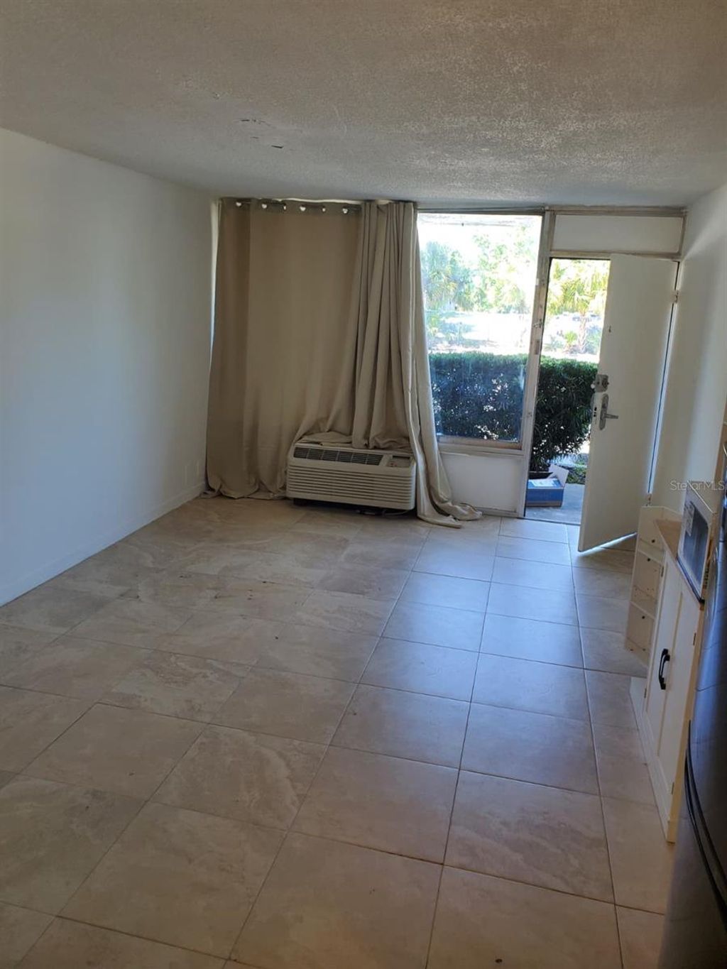 Photo of 7900 S Orange Blossom Trail #1009, Orlando, FL 32809 (MLS # S5146508)