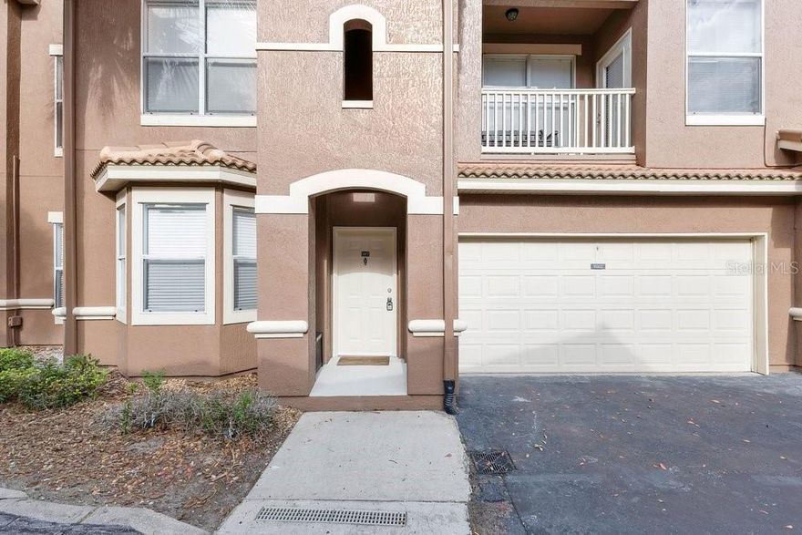 WOW! Rare Opportunity; Prime Location! Beautifully fully renovated 3-bedroom, 2-bath home with a 2-car garage featuring epoxy flooring. This property is truly a must-see! Enjoy modern upgrades throughout, including new porcelain tile flooring, brand-new cabinets, and updated finishes that create a fresh, move-in-ready feel. Relax on your private balcony overlooking a peaceful pond with a water fountain, perfect for unwinding after a long day. Major updates include a new roof (2023). Conveniently located just steps from the community pool and playground, this home offers both comfort and lifestyle. The community features resort-style amenities, including a 24-hour fitness center, pool, volleyball court, playground, carwash. Location is everything, and this one delivers! You’re just minutes from Walt Disney World, with easy access to International Drive, Highway 192, and the Orange County Convention Center, plus world-class dining, shopping, and entertainment. The perfect combination of location, lifestyle, and value in one of Orlando’s most desirable areas. PLEASE SCHEDULE YOUR SHOWING TODAY!