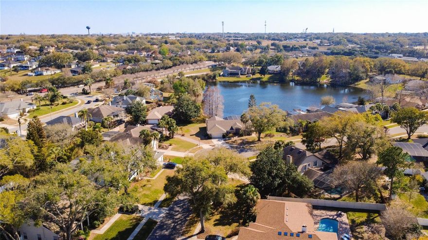 Experience the best of Central Florida living in this **stunning waterfront pool home**, where serene views and thoughtful upgrades create the perfect private retreat. From the moment you enter through elegant double French doors, you’re welcomed by breathtaking sightlines that extend from the formal living room across the screened lanai and sparkling pool to a tranquil, spring-fed pond—ideal for birdwatching, fishing, and everyday relaxation.

This spacious 4-bedroom, 3-bath residence offers a versatile and well-designed layout with both formal and casual living areas. The family room features soaring vaulted ceilings and a cozy wood-burning fireplace, creating a warm and inviting atmosphere for gatherings. The beautifully renovated kitchen (2026) showcases brand-new appliances, Uba Tuba granite countertops, ample cabinetry, and an open design that seamlessly connects to the living spaces while overlooking the pool and water views.

Throughout the home, you’ll appreciate the value of **major upgrades that provide true peace of mind**, including a brand-new A/C (Sept 2025) for energy efficiency, a full home repipe completed in 2019, a newer water heater (Aug 2020), and fully remodeled bathrooms (2025) with modern finishes—along with the completely upgraded kitchen featuring all new appliances (2026), offering both style and functionality.

The primary suite is a true sanctuary, offering direct access to the pool, peaceful waterfront views, a large walk-in closet, and a spa-inspired bathroom with dual vanities, a garden tub, and a separate shower. The fourth bedroom is perfectly suited as a home office or guest suite, enhanced by calming fountain views.

Step outside to your private, screened lanai—pre-wired for cable and designed for year-round enjoyment, whether hosting guests or unwinding in your own tropical setting. Additional features include an interior laundry room with washer, dryer, and utility sink, plus a convenient pool-access guest bathroom.

Combining **breathtaking water views, modern upgrades, and exceptional indoor-outdoor living**, this move-in ready home is a rare opportunity to own a true Florida paradise. Don’t miss it!
