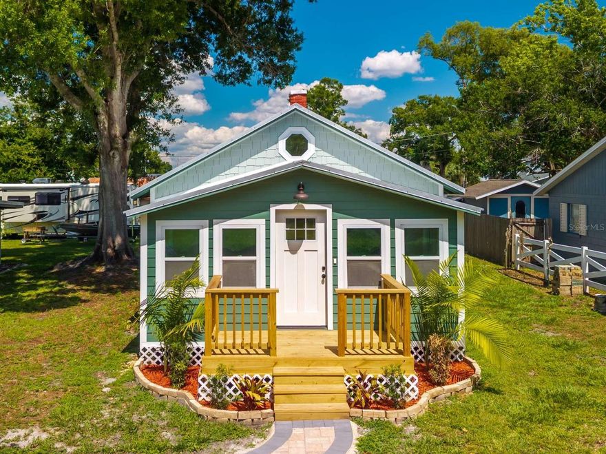 Nestled in the heart of Central Florida you will find this lovely, completely renovated cottage home originally built in the 1940s. This cozy 2-bedroom, 1-bath home has been redesigned to display a beautiful, vaulted ceiling in the main living space by exposing the original architecture of the historic home. Modern luxury vinyl floors run through the home creating the perfect balance between old and new with elements of the home that retain its original charm such as the exposed chimney bricks and reclaimed original doors. A modern, sleek kitchen design with all new stainless-steel appliances offers the perfect space for cooking and entertainment. The peaceful outdoor deck and pergola provide extra space for entertaining guests or simply relaxing outdoors. You will experience the best of both worlds in this calm and quiet neighborhood that is also HOA-free. Located just blocks from charming downtown St. Cloud, you are minutes away from local shops, restaurants, St. Cloud High School, and best of all, the beautiful lakefront of East Lake Toho. Although this warm home retains all of its original charm, homeowners can feel at peace knowing that it has been completely re-plumbed, a new central HVAC system has been installed, the entire home has been updated with new electrical outlets and switches, brand-new siding encompasses the entire home, and that a new, resilient metal roof, known for their long life/durability, covers the home. Do not miss out on this unique gem right in central Florida, this is what having a Florida home is all about!