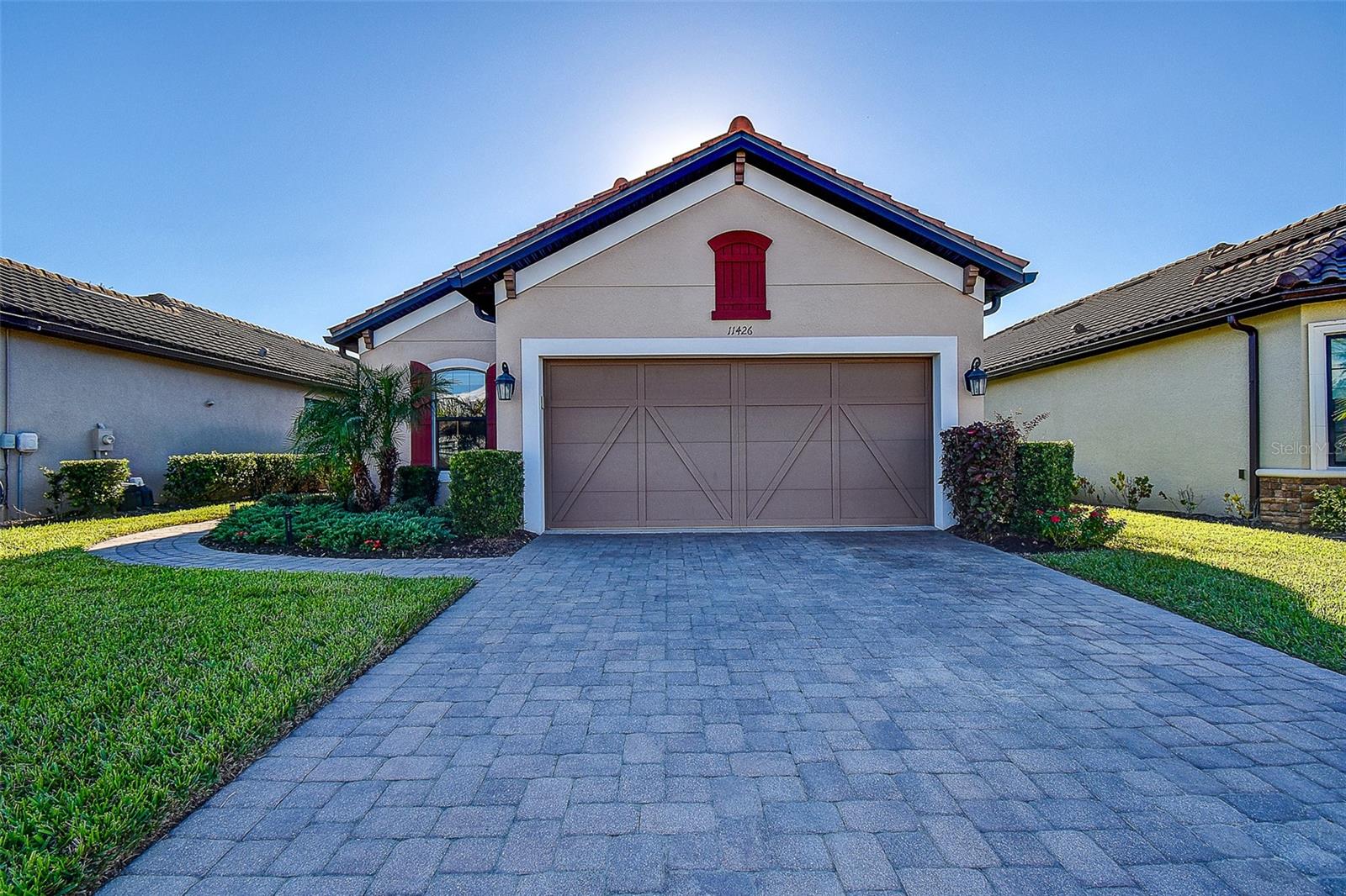 This former model home is situated on premium lot in the stunning Starkey Ranch Esplanade Community. The Arezzo model has it all!  Three bedrooms, two full baths, a den/bonus room and a formal dining area with an open concept wrap-around kitchen with stainless steel gas appliances and granite countertops. The lanai features travertine pavers, a tongue and groove ceiling and stacked stone fireplace which overlooks the fully automated spa and fountain area with breathtaking views of the pond.  This home has many upgrades including a four foot extended garage, tray ceilings in dining, living, den and primary bedroom with crown molding, feature walls and designer Levolor power blinds in living area.  Additionally, this beautiful home is wired with surround sound inside and on lanai, a security system, tankless water heater, water softener, custom closet organizers and 2025 electric water heater for spa.  Esplanade at Starkey Ranch has a beautiful 6,000 Sq. Ft. Clubhouse with amenities that include a fitness center, resort-style pool and spa, dog park, play ground, tennis and pickleball courts, bocci ball, outdoor fire pit and a full-time lifestyle director who coordinates many exciting social events throughout the year!!! The Starkey Ranch community offers additional parks, pools, splash pad, playgrounds, dog parks, and access to the Starkey Ranch District Park and Library. Conveniently located near shopping, dining, hospital, top-rated schools, beautiful beaches, and just a 26 mile drive to Tampa International Airport.