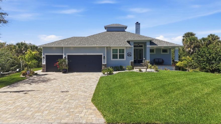 Step into the perfect fusion of modern coastal elegance and country coastal charm in this stunning 2022-built 3/2/3 waterfront pool home, offering 2,062 sq ft of refined living space (3,280 total). Thoughtfully designed for comfort and privacy, two of the three bedrooms are full suites with ensuite bath and walk-in/thru closets—a rare and luxurious feature. Nestled in a quiet, peaceful pocket of Port Charlotte, this home delivers the serenity of nature with the sophistication of today’s best design trends. A welcoming large front porch with a beautifully stained tongue and groove ceiling sets the tone, while concrete pavers unify the front driveway, walkway, front porch, back porch, and pool area for a cohesive, upscale look. The expansive covered back lanai, also finished in stained tongue and groove, pairs with the heated saltwater pool with oversized splash area to create a breezy, resort style outdoor living experience. Enjoy sun and shade seating, an outdoor shower, and a stylish black metal fenced yard. Just steps away, your composite dock with covered boat lift offers immediate access to the Myakka River, Charlotte Harbor, and the Gulf—a boater’s dream. Inside, the home blends clean modern lines with warm, rustic touches. Luxury vinyl plank flooring, 6-panel wood doors, custom wood shelving in every closet, and shiplap accents pair beautifully with sliding barn doors and a real wood-burning fireplace, creating a relaxed yet elevated atmosphere. The zero corner sliding glass door opens the entire living space to the screened lanai, blurring the line between indoors and out. The kitchen is a true showpiece, featuring upgraded appliances, a built in multifunction oven (convection, air fry, bake), a built in microwave above, induction cooktop, huge island with breakfast bar, stone counters, dry bar, walk in pantry, and abundant cabinetry—perfect for both everyday living and entertaining. Architectural details shine throughout, including tray ceilings in both suites and the living room.
Practical luxury is built in: whole home reverse osmosis system, 22KW Briggs & Stratton generator with 250 gallon buried propane tank, tankless water heater, rain gutters, irrigation system, and a 3 car garage with 12' ceilings and open cell foam insulation. The laundry room offers a utility sink, stone counter, and built in cabinetry for added convenience. This home captures the essence of modern coastal living with a warm country edge—inviting, stylish, and designed for effortless waterfront enjoyment. Call today for a private showing.