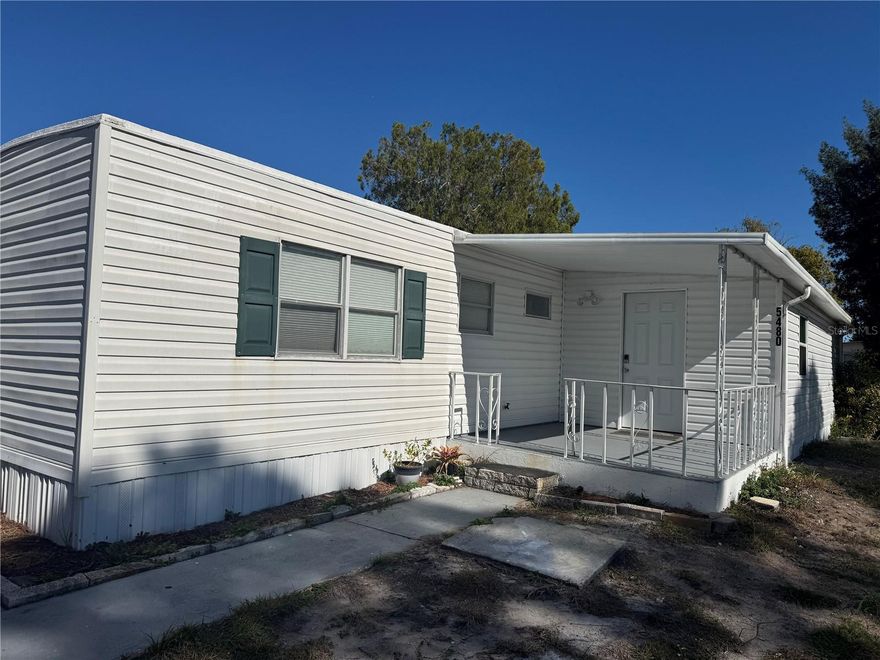 Up-to-date manufactured home built in 1971, situated on an owned corner lot in desirable Port Orange. No HOA fees. Recent updates include a new roof and new AC. Property offers ample parking, washer and dryer hookups in the carport, and an enclosed porch providing additional living space. Cash offers only.