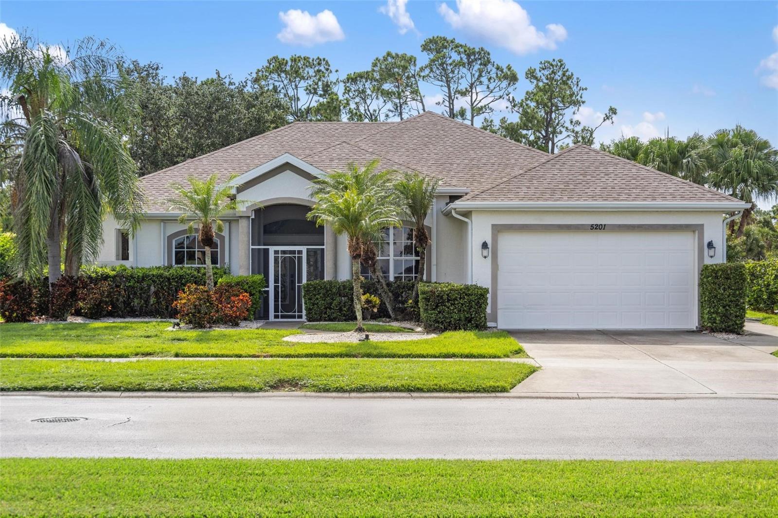 Imagine waking up every morning to your own private Florida oasis in one of the few gated communities in North Port, with no neighbors in sight, in a home where comfort meets style. This beautifully maintained {saltwater} pool home checks every box on your wishlist, and then some. Inside, you’ll find a spacious layout and modern updates that today’s buyers are searching for: high ceilings, an abundance of natural light, stylish finishes, and a split-bedroom floorplan for privacy. Featuring three (3) bedrooms, two (2) bathrooms, a den/office, oversized two-car garage with separate golf cart garage door, and just under 2,000 SF of living space, this rarely available floorplan is ready to be your next home! The kitchen features granite countertops, white cabinets, modern stainless steel appliances, a pantry closet, and just enough space to set up your coffee/beverage bar next to the breakfast nook as you gaze out the bay window onto your backyard oasis. One of our favorite features: the beautiful wood-look tile throughout the entire house (there’s no carpet anywhere!) that seamlessly connects each room.
The primary suite? It’s a true sanctuary—with direct access to the lanai, a spacious bathroom with dual vanities, private water closet, walk-in shower, and a walk-in closet just big enough to hold all of your clothes. As you walk through the great room towards the other side of the house, you’ll find two (2) other bedrooms, one (1) full bathroom, and a separate outer door to the lanai for easy access to the bathroom from the pool. ALL of the bedrooms feature ceiling fans and high ceilings. Step through the Kitchen towards the laundry room where you’ll find lots of storage space, a matching front-loading washer and dryer set that stay with the home, and a large wash sink. Step outside to your spacious screened-in lanai where you can relax in the Florida sunshine, surrounded by complete privacy and the beautiful scenery of flowering plants, palms, and Spanish Moss in the Live Oak Tree as you enjoy the sparkling blue waters of your large saltwater pool. The covered area is spacious enough to host a large hot tub (like the one featured here), and still offer plenty of space for seating and entertaining. An outdoor shower sits just right off the pool for easy showering before or after swimming! The oversized garage (with separate outer door and side golf-cart entry garage door) features a new FPL EVolution Charger (for the electric car owner), NEWER ROOF installed in 2023, NEWER HVAC SYSTEM installed in 2023, NEWER Electric Water Heater from 2022, and a whole house water softener system. OTHER IMPORTANT FEATURES WORTH NOTING: Accordion Shutters have been installed around 4 windows, and the Kevlar Roll-down Hurricane Screens are situated at the front door entryway, as well as on the back lanai just inside the covered area for easy storm prep. Whether you’re entertaining friends or unwinding in solitude, this home delivers both style and serenity without compromise. You’re not just buying a home - you’re investing in your lifestyle, your peace, your future. And at this price point, this is the kind of value that doesn’t come around often.