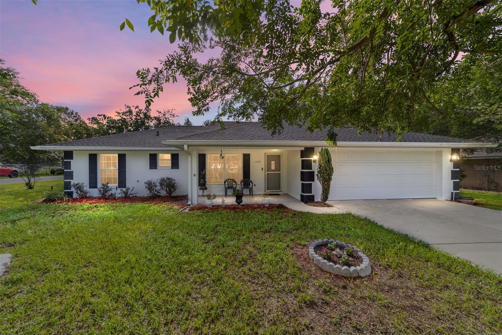 Road Assessment Paid Off in advance, offering a brand new, glorious paved road and huge savings! New roof in 2022. Please enjoy this lovely 3/2/2 corner lot that backs up to a wonderful family-owned farm offering wonderful views. Enjoy the large covered front porch, gutters, oversized shed, irrigation, and mature landscaping. Inside, you will find a split floor plan with spacious living space throughout. Each bedroom has a walk-in closet; an oversized enclosed FL room needs only heat/AC to convert into living space. The primary bedroom is majestic in size. This jewel has had one family owner who has cared for it diligently over the years. Call today to schedule your very own private showing.