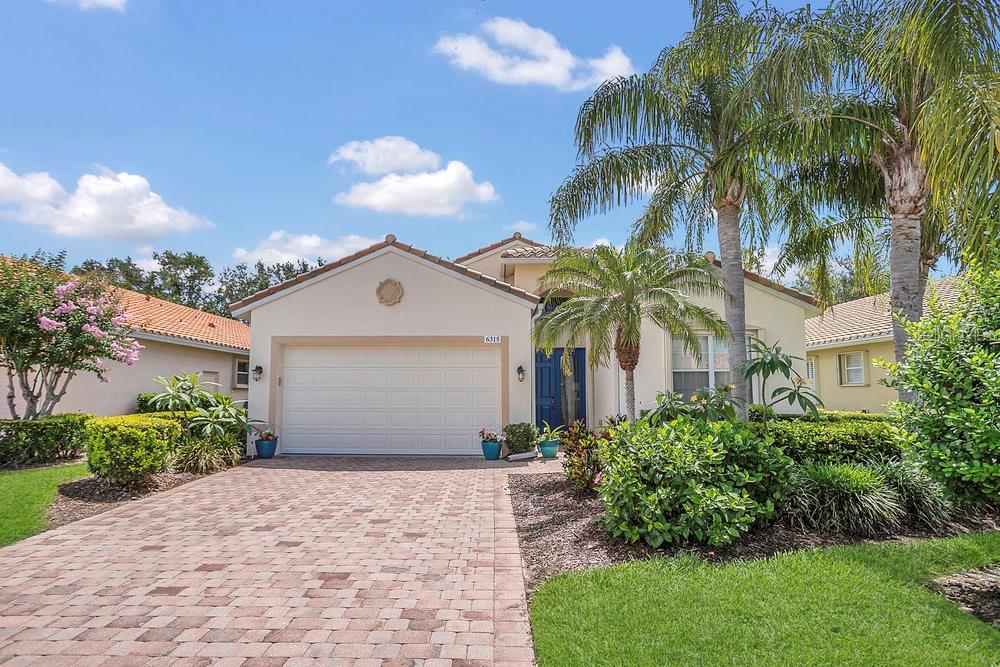 For those who cherish an active lifestyle, discover your perfect two-bedroom, two-bathroom home with den and a two-car garage, offering nearly 2,000 square feet of bright, airy living space built with block construction in Cascades, Sarasota’s premier 55+ community. Although this residence was bought less than a year ago as a forever home, changing life circumstances have led to its availability. The owners, who did not originally intend to move, have made numerous upgrades: the interior freshly painted with Sherwin-Williams Emerald paint; driveway pavers sealed; tile and lanai roof meticulously cleaned and treated with a protective coating; new lanai screens installed; garage walls repainted and new epoxy flooring added; all living areas (except recently updated bedrooms) fitted with new engineered hardwood floors; new GFCI outlets and matching electrical covers throughout; and a brand new KitchenAid dishwasher. This highly desirable St. Kitts floor plan thoughtfully separates the bedrooms by the living space and features an open kitchen layout. Revel in soaring ceilings and a private pavered lanai—the ideal spot to unwind with your favorite drink or nurture your plants in peaceful solitude. The master suite boasts two walk-in closets and a spacious bathroom equipped with dual vanities, a walk-in shower, soaking tub, and a separate water closet. Hosting guests is a breeze with a generously sized dining room and a large eat-in kitchen. The guest bedroom is enhanced by a built-in dresser, while the versatile den serves as either a home office or an extra bedroom, thanks to a desk that folds into a Murphy bed. Additional highlights include newer appliances, a 2020 air conditioning system recently serviced, freshly cleaned and serviced storm shutters, and a convenient interior laundry room. Spanning more than 25,000 square feet, the recently renovated clubhouse offers a heated pool accessible both indoors and outdoors, alongside a spa, sauna, fitness center, and six Har-Tru tennis courts. Additional facilities include a large banquet hall/theater, billiards room, bocce ball courts, horseshoe pits, and two pickleball courts. Residents have the opportunity to engage in pottery classes complete with an on-site kiln, arts and crafts, and a variety of social clubs. With a full-time social director, a tennis professional, and a part-time fitness instructor, there is always an activity to enjoy. This gated community is conveniently located close to downtown Sarasota, Sarasota International Airport, pristine beaches, and premier golf courses, providing a comprehensive lifestyle. Association fees cover amenities such as cable TV, fiber-optic internet, neighborhood security, lawn care, partial plant maintenance, and irrigation, with no CDD fees, and permits two large pets. Discover luxury, resort-style, maintenance-free living in this exceptional home!