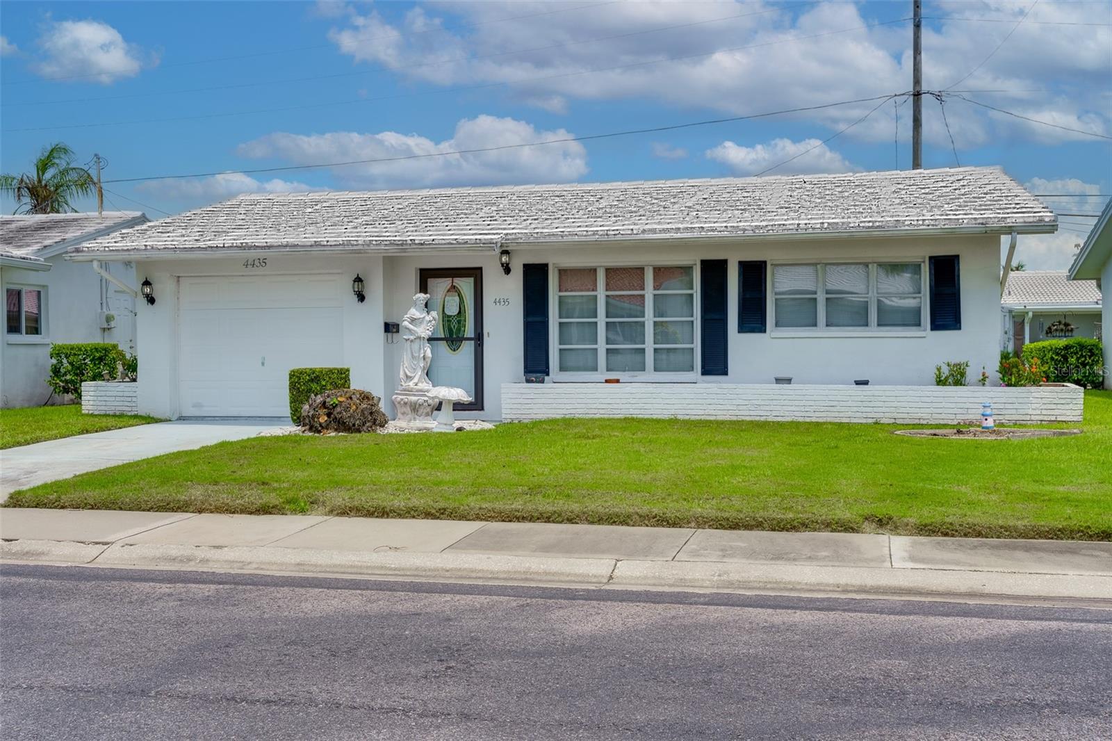 Don't miss this move-in ready 2bd 2ba 1 car garage Baldwin model. The completely renovated kitchen with granite counter tops and soft close cabinets with tile backsplash is the center of the home. The large kitchen opening with bar seating opens up to the 30 X 14 family room, great for entertaining. The primary bedroom has custom wall to wall closets with pull out drawers for great storage. The en-suite is a new addition with walk in shower, sink and commode. Off the family room is an outdoor patio to enjoy the Florida lifestyle while grilling and enjoying the beautiful weather. Maintenance fee of $429.40 monthly includes: water/sewer/trash, roof repair/replace, cable, internet, wifi, community pool, clubhouse, exterior painting, ground maintenance and lawn care/irrigation. Mainlands is an active community offering a golf course, shuffleboard, plenty of activities and centrally located near beaches, airports, interstates and sporting venues.
