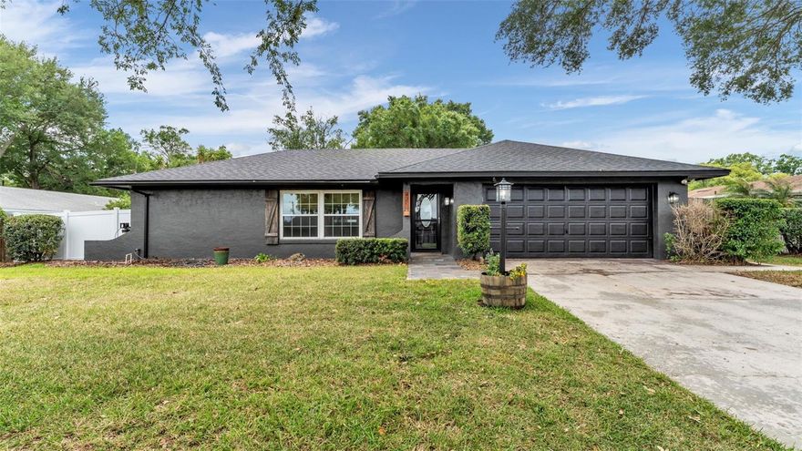 Welcome to this Charming Remodeled 3 Bedroom 2 Bath Pool Home filled with Phenomenal Character. This home is nestled in the heart of south Lakeland right off Hallam Drive. As soon as you approach the home, the curb appeal catches your eyes immediately! You will notice the home has been freshly painted and has a charming lamp post adorning the driveway, and a welcoming paver walkway leading to the front door. When you walk in you will notice the brand-new wood laminate flooring throughout, elegant crown molding, and detailed trim work through the doorways. The living space is thoughtfully divided into distinct areas: a cozy living room and dining room combination, and a second space housing the kitchen and family room. The kitchen, is a chef's delight, featuring granite countertops, stainless steel Kitchen Aid appliances, a stylish new backsplash, shaker-style cabinets, and modern hardware. The addition of a double thick butcher block counter near the stove provides both functionality and warmth, perfect for preparing meals. The Family room has Built-in shelves which adds to the home's charm. The master bedroom impresses with its spaciousness and boasts a full renovated en-suite bathroom complete with ample closet space, a walk-in shower, and a substantial vanity. Both bathrooms have been tastefully remodeled to enhance comfort and style. French doors from the family room open onto a screened-in porch and pool area. When you step outside into your own personal oasis, complete with a large in-ground pool perfect for entertaining! With high-end finishes, thoughtful modern touches, and recent upgrades including New Roof in 2024. This Home is Convenient to Restaurants, Shopping and Access to Polk Parkway for an easy commute to Tampa or Orlando, this is truly Florida living at its best!