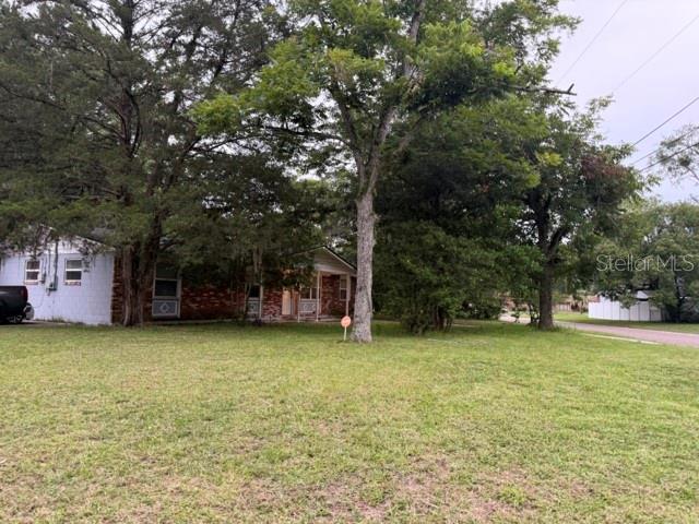 Home is tenant occupied, please do not disturbed. Nice concrete block home, on corner lot with a 2 car detached garage, fenced back yard. Formal living room with den/family room