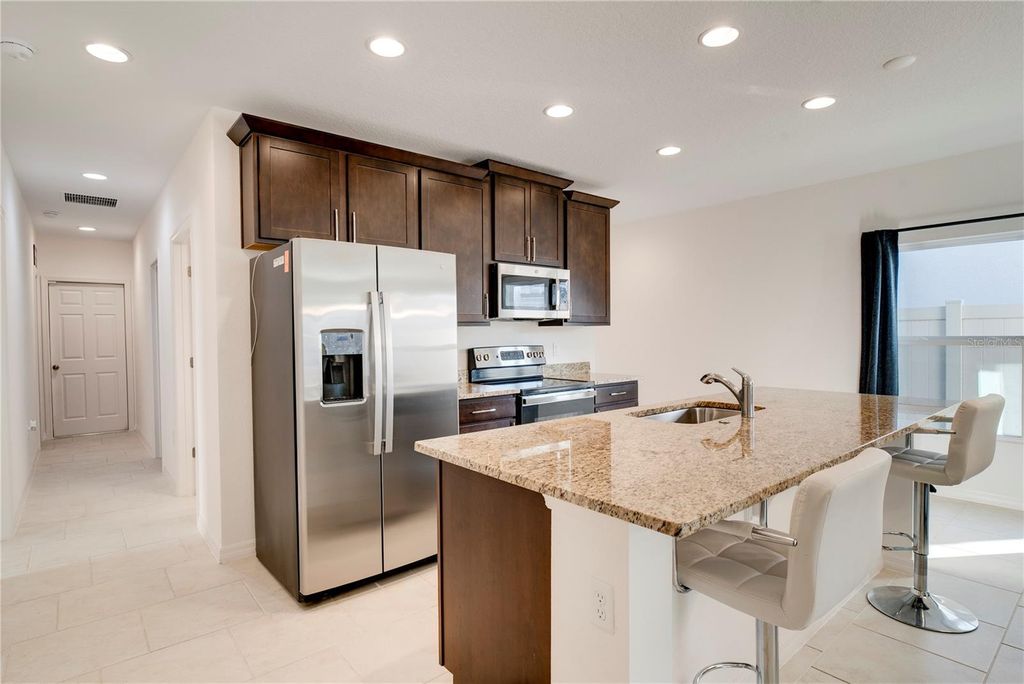 Photo of 1624 Swan Swim Dr, Davenport, FL 33837 (MLS # O6383788)