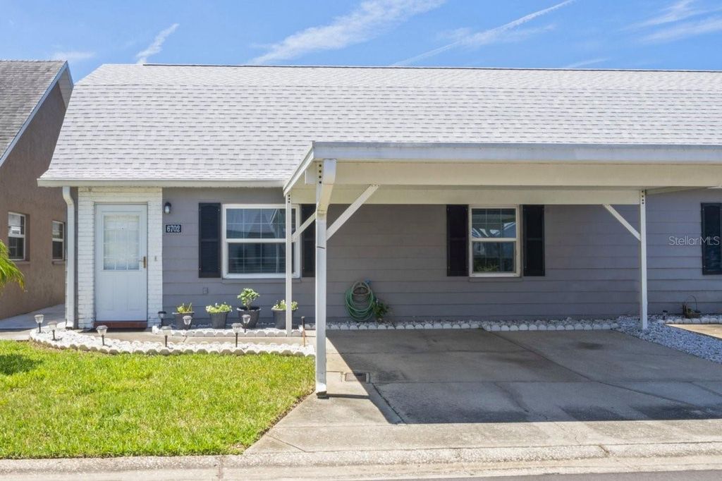 Photo of 6702 Dartmoor Ln #7A, New Port Richey, FL 34653 (MLS # W7876605)