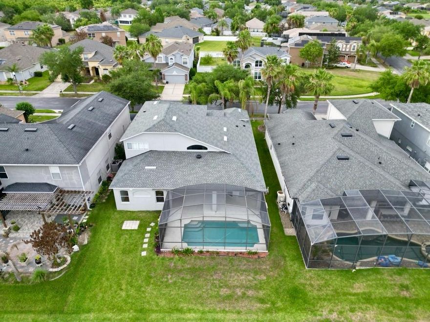 Welcome to 13728 Fox Glove St, a MOVE-IN READY luxury home on the 14th hole in the guard-gated golf community of Stoneybrook West in Winter Garden. This 5-bedroom, 3.5-bath home offers nearly 3,400 sq ft with soaring ceilings, abundant natural light, and an open-concept layout perfect for living and entertaining. Neutral tones create a bright, timeless feel throughout. Enjoy seamless indoor-outdoor living with dual sliding doors leading to an oversized covered lanai, screened pool, and stunning golf course views. Major updates include a NEW ROOF (2025), NEW UPSTAIRS AC (2025), and DOWNSTAIRS AC (2022). Community amenities include 24-hour security, golf, clubhouse, fitness center, resort-style pool, sports courts, playground, fishing pier, and Black Lake access with boat ramp. Convenient to Winter Garden Village,  SR-429, and downtown Winter Garden. TOP RATED SCHOOLS! Call today!
