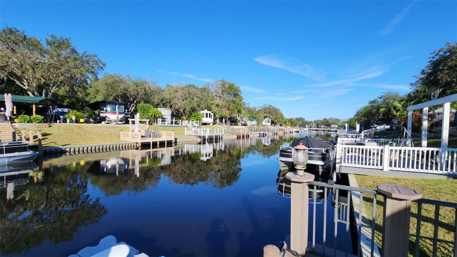 Direct WATERFRONT Deeded LUXURY RV LOT, Completely Renovated in Central Florida! WELCOME TO RIVER RANCH, Florida’s Luxury RV Resort with access to Lake Kissimmee! This is Glamping at its best! WELCOME TO RIVER RANCH, Florida’s Luxury RV Resort with access to Lake Kissimmee! This privately owned RV lot is located in Phase 5 and has been renovated from top to bottom! The plumbing, sewer line, electric, pavers, irrigation, and custom pavilion and firepit are all NEW NEW NEW! You can PULL in or BACK in , whichever fits your set and views the best. There are full hook ups on both sides. The dock is composite material (not new.) There is an awning on the dock as well as dock lighting. The seller left the yard clear so that you can custom landscape as you wish! Bring your Boat, Jet Ski or Kayak and float down the River! There is also access to Lake Kissimmee where you can enjoy the vast waterways and chain of lakes in Central FL! This lot offers shade and sun - the perfect combination! River Ranch RV Resort is perfect for weekend vacations, family camping, seasonal living! River Ranch RV Resort offers beautiful landscaping and privately owned RV lots. There are many amenities such as Pools, Tennis, Pickle Ball, Clubhouse, Social Events, Billiards, Poker Room and more! LOOKING FOR FUN!! It's all here! There are MANY fun things to do! For starters, there is a LIVE Rodeo every Saturday night – an excellent display of showmanship and fun for the entire family! There is even a Saloon (family friendly), with LIVE bands, DJs, dance parties and they give line dancing lessons for free. There is an adventure park which has a bounce house, mechanical bull, climbing tower, Arcade, mini golf, outside movie on the greens, bicycle rentals, airboat rides, river boat rides, swamp buggy, hayrides, petting farm, trap & skeet range and a bow target for shooting. There are several places to eat on property. The River Ranch Chop House serving delicious food and drinks, a waterfront Smokehouse Grill serving delicious BBQ, a pizza shop and an ice cream and coffee shop (serving Starbucks.) There is also a General store and a Western store to grab all of your favorite Cowboy/Cowgirl finds! Watch the Bison, Steers, Horses and other wildlife! Don’t forget to check out the Petting Farm!!