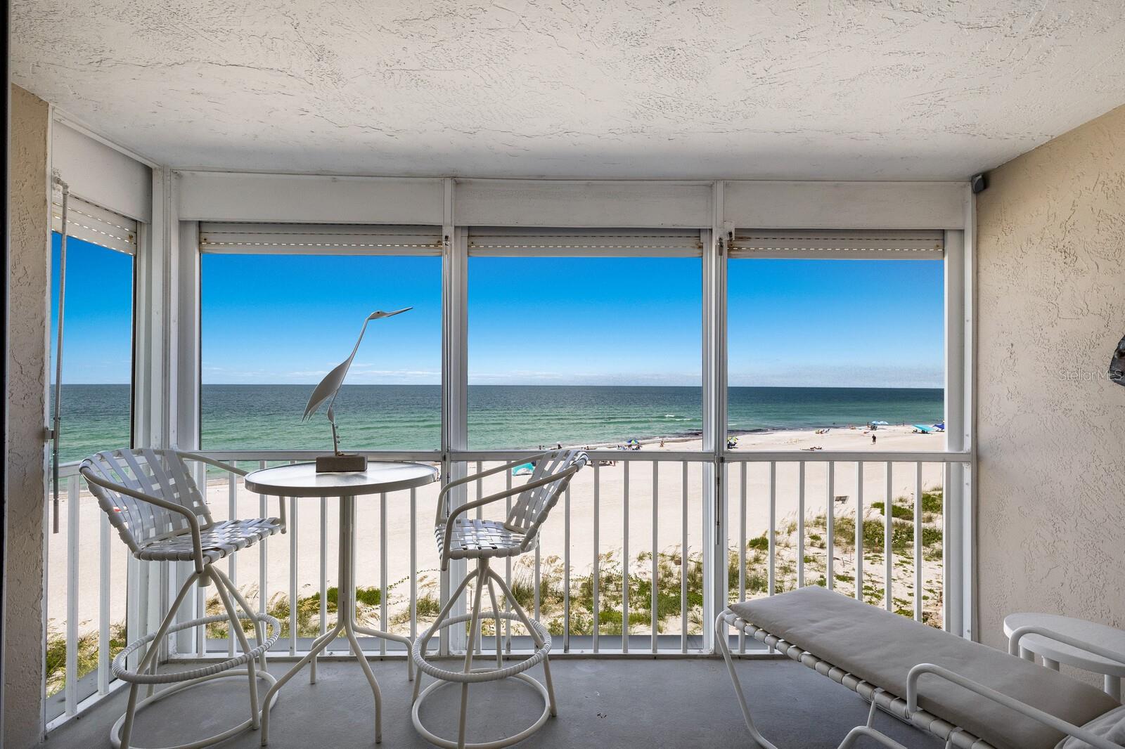 Spectacular views of the Gulf of Mexico from every room in this SPACIOUS Gulf Front condo. You MUST SEE THE SUNSETS from your open balcony!! Updated kitchen, windows and sliding glass doors. Martinique South is located in the heart of Holmes Beach, on Anna Maria Island. Building elevator with secure entrance. Close to everything...restaurants, shops, hardware store, fitness center and much more! Just bring your swim suit and toothbrush, everything you need is already here. Plus, it comes with a garage and storage room! Washer/dryer in the kitchen, spacious walk-in closet in Primary Bedroom. Beautiful community room facing the Gulf is great for parties and get togethers.