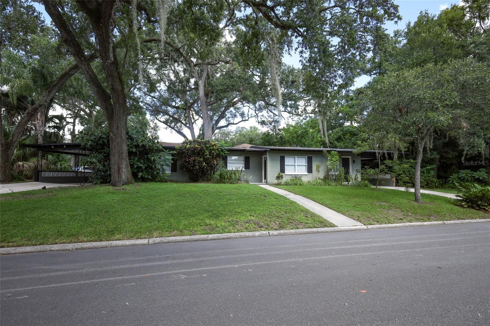 Income producing duplex in a PRIME LOCATION IN COLONIALTOWN. New roof in 2019, A/C units replaced in 2020, new plumbing replaced in 2020 and updated electrical in 2022. This mid-century modern duplex rests on a large corner lot where you will find yourself walking distance to your local Publix, delicious restaurants, bars and coffee shops. Lake Eola Park, YMCA, MILK District and quick access to I-4 and SR 408. Both units feature private laundry space, separate driveways and an outdoor space for entertaining. This is a great opportunity to invest or live in one unit and rent out the other unit for sustainable income. Come and see this fantastic property today.