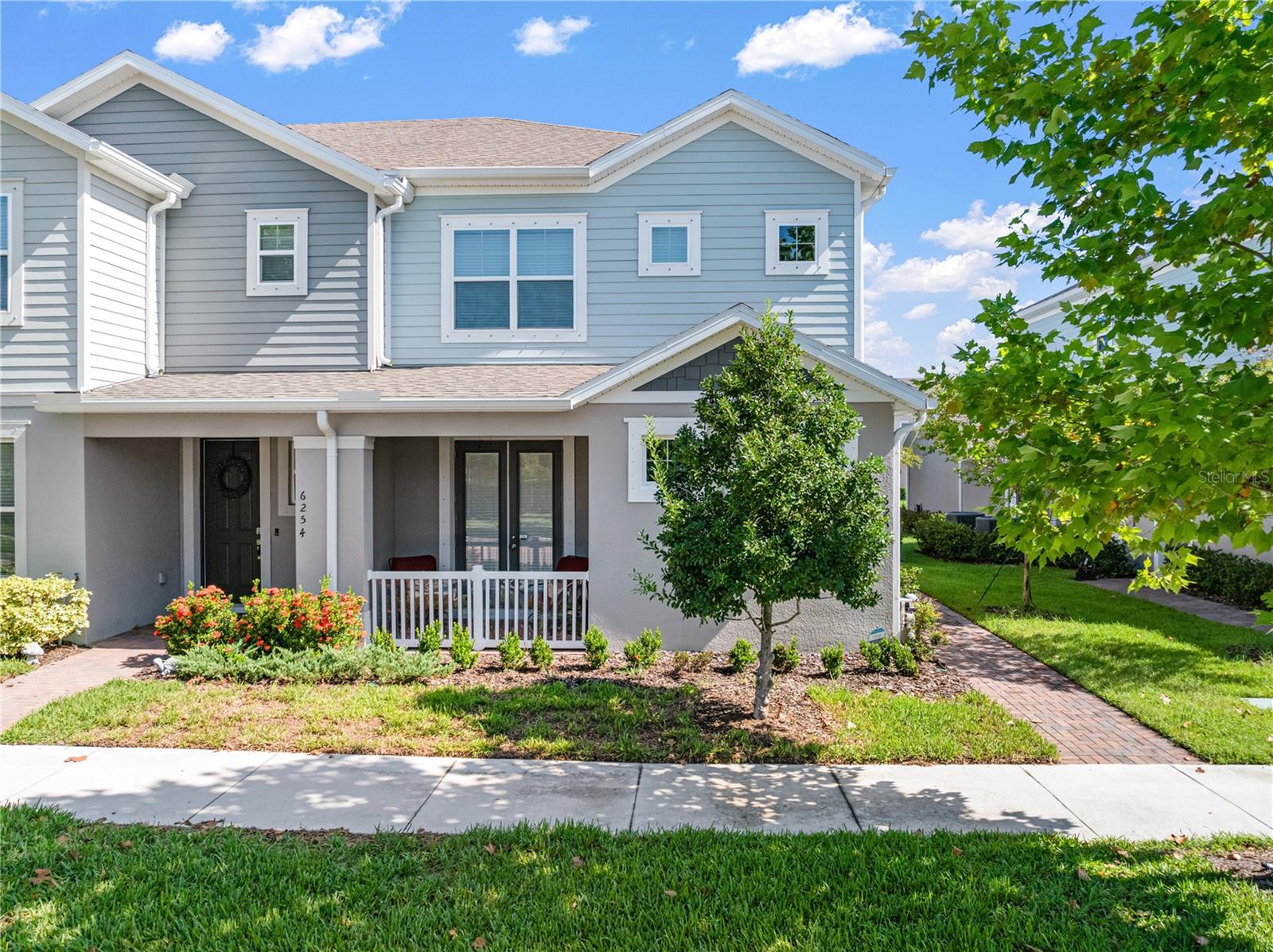 Highly Sought-After Adams Floorplan in Waterset- This spacious townhome offers the perfect blend of style and functionality, featuring the highly desirable primary suite on the first floor with tile flooring and access to a walkout covered patio. The gourmet kitchen showcases white quartz countertops, a large center island, and an open layout ideal for entertaining. A convenient guest half bath is located on the main level, along with a private paver patio leading to the two-car garage. Upstairs, a generous loft area provides flexible living space, accompanied by three additional bedrooms and two full bathrooms. Located in the sought-after Waterset community, residents enjoy an abundance of amenities, including resort-style pools, fitness centers, clubhouses, playgrounds, sports courts, trails, and a dog park, all within a vibrant neighborhood setting.