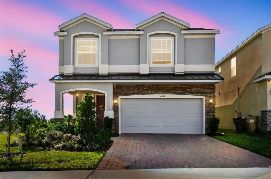 This 5-bedroom, 2.5-bath offers the perfect blend of privacy, and modern convenience. Definitely a perfect location for any one who wishes to revel in the great outdoors! It is a newer Landsea Vero Smart Home situated on a corner lot with no rear neighbors, ready for a pool, and is absolutely ONE OF A KIND!! Since only May this year the owners moved in and planned on living here for many years to come. So, they did not hold back on anything. From the beautiful stone accents on the exterior of the residence, to entering the open living area that boasts a gorgeous custom stone fireplace and mantle, wall accents, custom light fixtures, and fans. Enjoy the sealed porcelain tile plank flooring throughout the first floor, and everything was professionally painted with Sherwin Williams Agreeable Gray. Expect only the best in your Chef's Kitchen that offers upgraded pendant lights, quartz counters and a large quartz island with plenty of room to sit and enjoy your time with each other.. Check out the additional kitchen pantry to store your small appliances. All new stainless appliances stay in the kitchen. The owner added cabinets in the laundry room,  screened in the lanai, and and the thoughtfully designed 2 car garage offering tons of extra ceiling storage, 220V outlet, along with the 220V wiring ready for up to 2 Tesla charging stations. As you head upstairs you will be in awe of the decorative iron railing leading to a spacious loft. The Primary Suite is one of the largest you will ever see. It is a large Bedroom with an additional 11X11 space. This additional space could be a nursery, work area, place to exercise, you choose! Large Walk-In Closet along with a double quartz vanity and extra large shower where you will surely enjoy your 2 shower heads since 1 is an oversized overhead rain shower. Additionally upstairs are 3 oversized bedrooms and another bath with a double quartz vanity.  The community offers access to a resort-style pool, playground and is a haven for all to enjoy boating, biking, hiking, fishing, camping and more right across the street. Louisa State Park has many opportunities for endless adventures. Just minutes away, you’ll also find Clermont’s charming downtown, filled with local dining, boutique shopping, weekly farmers’ markets, and events that bring neighbors together. To the north, the highly anticipated Olympus Sports Complex is under development. Olympus is to uniquely combine health, wellness, fitness, sports, hospitality and entertainment into one complete community and global destination all right in your own backyard. As you can clearly see, Ridgeview is not just a place to live; it's a lifestyle where you are sure to enjoy the rolling hills, the chain of lakes, Lake Louisa State Park, Downtown Clermont, Olympus Sports Complex while only 20 minutes from Disney and able to enjoy the Magic Kingdom Nightly Fireworks.