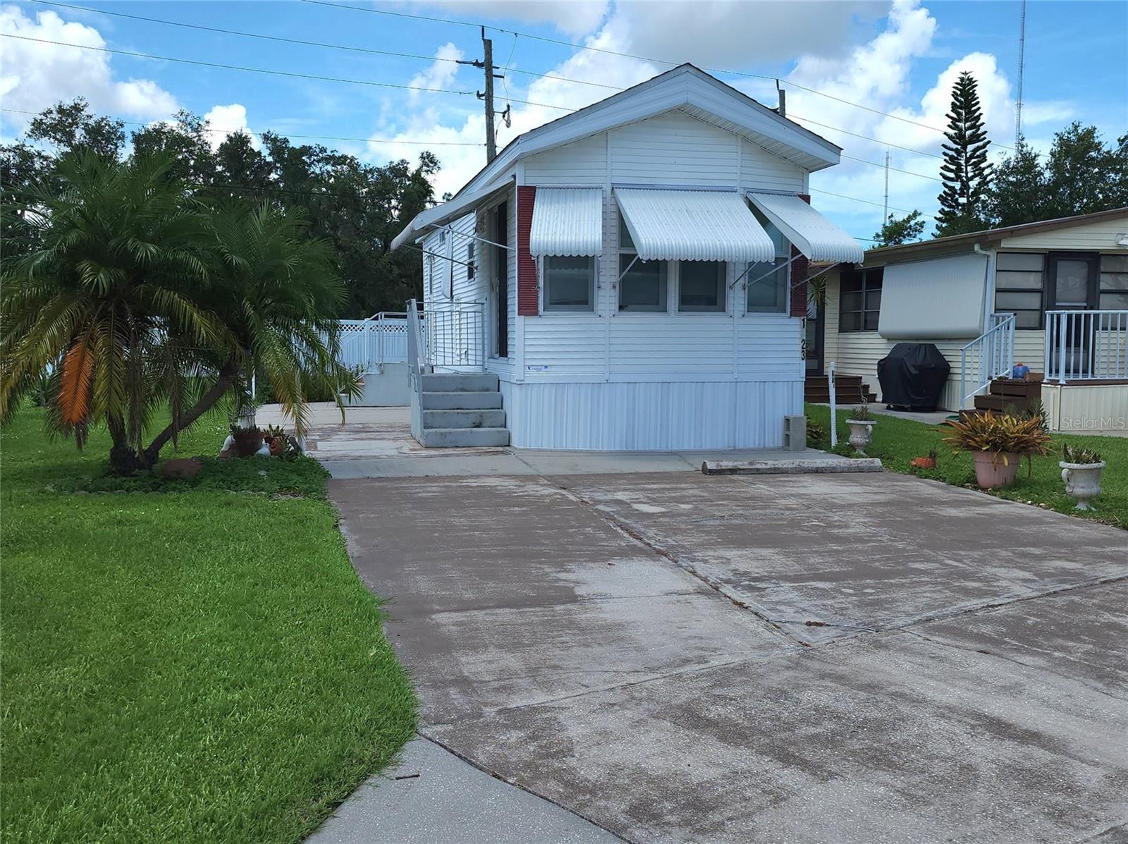 PET FRIENDLY, SINGLE WIDE MOBILE HOME IN ACTIVE 55+ COMMUNITY! So much to offer in this charming one bed, one bath turnkey Bradenton home. Features include room to park multiple vehicles, central air conditioning, awnings, side patio. SUGAR CREEK COUNTRY CLUB CO-OP has LOW HOA FEES of just $525 quarterly which includes water, trash, sewer, basic cable, internet, and grass mowing. There is an active social calendar with fun activities and outings during the winter months. Enjoy this community's proximity to the Braden River and River Links Golf Course. Pack the pooch and start enjoying your Florida life!