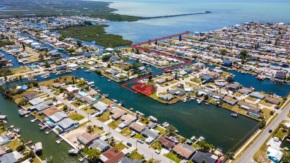 WATERFRONT INVESTOR OPPORTUNITY – SALTWATER CANAL LOT WITH GULF ACCESS! Rare chance to own a prime lot on a wide saltwater canal just minutes from the open Gulf — NO bridges or obstructions! The previous stilt home was lost due to an electrical fire, and insurance claims have been fully processed. Here’s where the opportunity begins: The property is 10ft above sea level and according to the county, the existing foundation and stilts may remain in place, pending structural engineer approval. This could potentially be significant savings for a savvy buyer or investor ready to build a custom dream home. The lot offers ample space to add a pool and enjoy waterfront living to the fullest. Located in a golf cart-friendly community with a vibrant social scene, including monthly events at the local civic center. Just a short ride to Hudson Beach, the Ice Cream Shop, Inn on the Gulf, and more. NO HOA. NO CDD. Don’t miss this unique rebuild opportunity in a desirable waterfront neighborhood. Call today for more details!