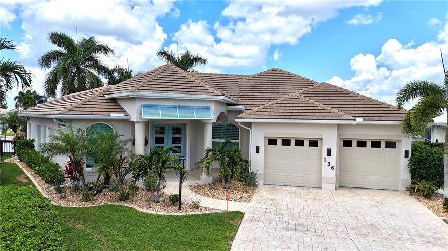 WATERFRONT BEAUTY IN DESIRABLE Punta Gorda Isles! Stunning, high-quality, move-in ready pool home situated on a key lot with an impressive 141 feet of waterfront and approximately 10 minutes to Charlotte Harbor by boat. Meticulously maintained and professionally landscaped, this exceptional residence offers the ultimate Florida lifestyle for boaters, fishermen, or anyone seeking luxurious indoor/outdoor living with peaceful water views perfect for enjoying your morning coffee or evening sunsets.

The backyard is truly an entertainer’s dream featuring a spa/pool overlooking the canal, expansive outdoor living spaces, and a beautifully appointed outdoor kitchen complete with a new stainless steel gas grill, bar area with mini refrigerator, and granite countertops. Boaters will appreciate the new 45-foot dock (2025), 10,000 lb. boat lift scheduled for installation, 141 feet of seawall, and quick powerboat access to open water. Recent exterior upgrades include new landscaping (2025), landscape lighting (2026), exterior paint (2026), impact windows on the front and rear of the home (2025), new pool pump and heater (2025), automated Jandy pool controls (2026), and a security system (2024). These improvements complement the extensive renovations completed between 2018-2020.

Inside, the home showcases serene waterfront views, neutral décor, plantation shutters (2025), automatic blinds on the sliding doors (2025), updated lighting and fixtures, and spacious living areas designed for both comfort and entertaining. The beautifully updated kitchen features a gas cooktop, high-end solid surface countertops, and custom cabinetry, while the remodeled bathrooms provide quality finishes and modern style. Additional improvements include interior paint (2024), new water heater (2026), and a new stackable washer and dryer (2025). The oversized garage provides ample room for two vehicles and includes a utility sink plus convenient motorized overhead storage shelving.

Located just minutes from historic downtown Punta Gorda, residents enjoy easy access to waterfront dining, shopping, golf, parks, entertainment, and all that this vibrant coastal community has to show. Combining luxury, boating convenience, and extensive modern upgrades, this exceptional waterfront property is ready to impress. Schedule your private showing today!