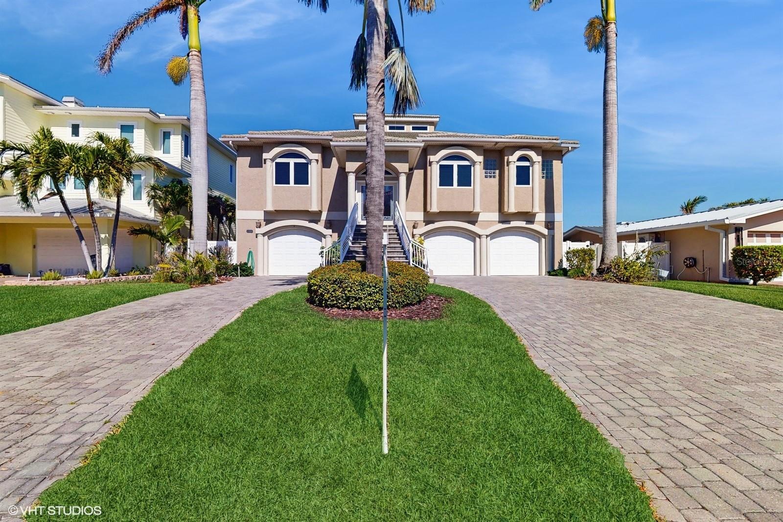 Beautiful views and incredible amenities await you in this move in ready 4BR 3BA waterfront home with salt pool, dock and 3 car garage on 70' wide lot on Isle of Capri in Treasure Island.
Enjoy single-level living in this elevated updated home at the beach, featuring a split floor plan, with formal dining room, vaulted living room with upper-level windows for soft natural lighting throughout the day, featuring wine fridge and wet bar, a two-sided fireplace to the living room and primary-bedroom, updated gourmet kitchen with newer appliances (2023) and even a dumbwaiter to the lower level. There is so much to love about this home, especially the flow passing through the pocketing 3 panels of sliding glass doors to the spacious outdoor balcony overlooking the pool and water views.
The spacious primary bedroom will calm you with those water views, and its own access to the balcony, a custom walk-in closet and incredible ensuite bathroom with individual vanities, jetted tub and separate shower.
Enjoy privacy with the split floor plan. The two primary guest rooms on the opposite side of the home share a spacious full bath.
The 4th bedroom features a murphy bed, and is convenient to the master suite, and could be a great home office.
Create wonderful memories down by the heated salt pool, where there is a complete outdoor kitchen and outdoor pool shower.
Enjoy the Florida boating lifestyle with your own composite boat dock with sink, power, and 14,000 pound lift.
And you are less than 10 minutes by boat to John's Pass and the open waters of the Gulf.
Lower level family room, full bathroom, additional clothes washer and second full-size refrigerator in the lower level for your swimming and boating adventures.
Plenty of room in the garage for all your vehicles and toys.
Treasure Island is a wonderful Florida beach town, centrally located to all that the region has to offer.
So many recent upgrades and improvements, including outdoor fans installed in December 2024,
stackable LG washer and dryer on the main living level, kitchen appliances updated 2023, "Easy Water" instant hot water throughout the home, and so much more!