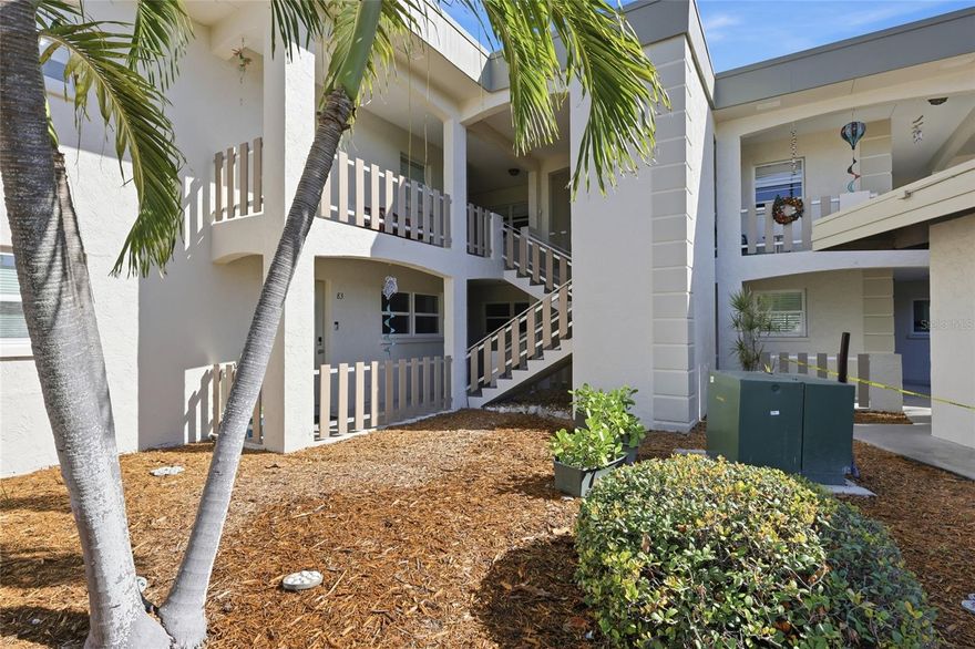 One or more photo(s) has been virtually staged. Welcome to Shell Point, a lovely waterfront community in the heart of Holmes Beach. This lovely updated condo is conveniently located near the Holmes Beach Boat ramp, tennis courts, basketball courts , dog park, and all within walking distance to shopping, fabulous dining and of course the beautiful beaches of Anna Maria Island. This lovely 2 bedroom 2 bath unit has been wonderfully updated with beautiful wood grain tile floors, all new appliances, trim, doors, kitchen cabinets, bathroom cabinets, lights, and ceiling fans.  It also boasts new window treatments, and hurricane windows and doors as well.  This little "gem" of an island retreat, has extra interior space (extra square feet)  with the bonus area that is located off of the living room.  This air conditioned interior space has beautiful natural light just pouring in all morning and offers a back door to access the community pool and courtyard which has walking paths.  A perfect space that can be used as an office space, reading space, entertainment space , or just a nice gathering space to rest and sip on your morning coffee.  This unit is all brand new and just waiting for you to start making it your new island retreat.