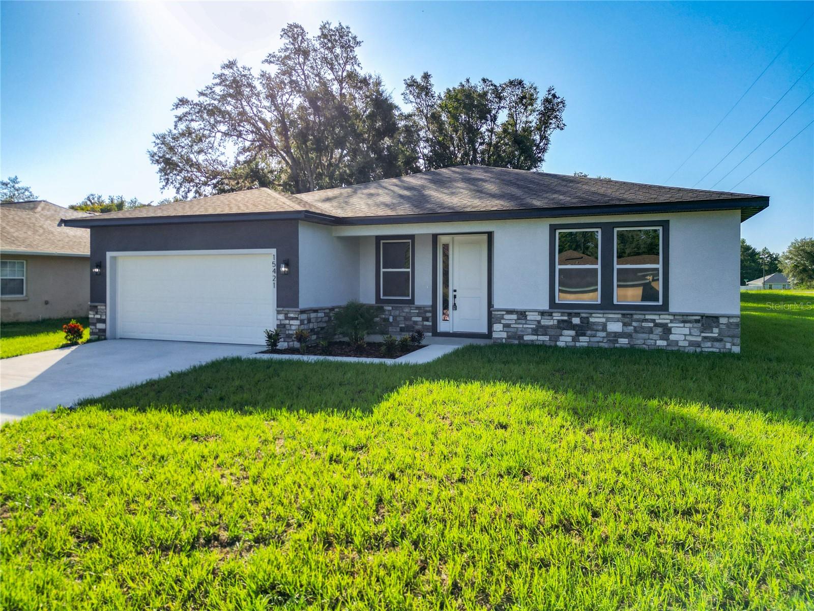 Your Ideal Home Awaits! Special Financing Incentive! Get a $1,000 lender credit when you use our preferred lender—can be applied toward rate buy-down or closing costs. Move-In READY NO Waiting. NO HOA. Discover the perfect combination of modern design and everyday comfort in this beautifully crafted, newly built home. With 4 spacious bedrooms and 3 full bathrooms, this residence is thoughtfully designed for both functionality and style. The heart of the home is an open-concept living area that effortlessly connects the living room, dining space, and a chef-inspired kitchen. The kitchen is equipped with sleek stainless steel appliances, quartz countertops, a generous island, and abundant cabinetry—ideal for both casual meals and entertaining guests.
Each bedroom offers ample space and storage, while the primary suite provides a serene escape with elegant finishes and a well-designed layout. Energy efficiency and modern craftsmanship shine throughout this move-in-ready home. Situated in a peaceful neighborhood, conveniently located near major highways, shopping, and schools—easy access and a great location in Marion Oaks!. Schedule your private tour today—this exceptional home won’t last long!