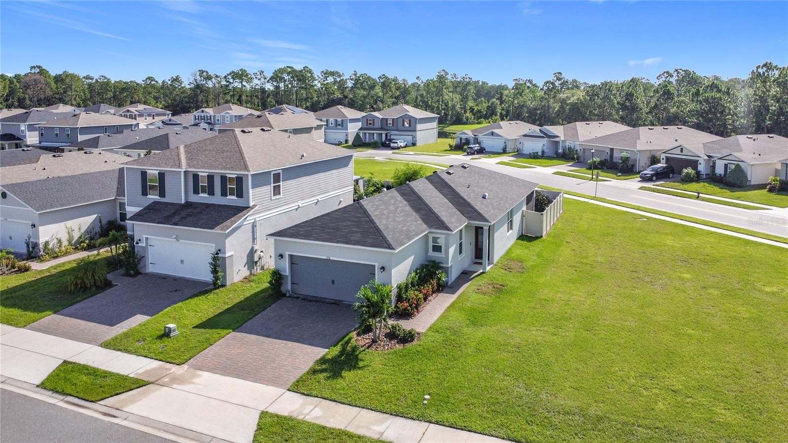 Welcome to this beautifully designed three bedroom, two bath home in the desirable community of The Sanctuary, Clermont, Florida. With undeniable curb appeal – tropical landscaping, corner lot and a spacious two car garage - the home sets the tone for what’s inside. You enter an open concept floorplan with a spacious kitchen equipped with stainless steel appliances overlooking a great room. The great room leads out to your backyard oasis – a screened patio and private fenced in yard. The split bedroom plan allows for added privacy as the primary bedroom is smartly located in the rear of the home . The flow of the home offers opportunity to entertain friends and family both inside and out. Beyond the home, the Sanctuary community provides a community pool, park, and fitness center adding to its appeal. While it feels peaceful and private, you are conveniently located near highways, shopping, dining and more. Call today to schedule a tour. This could be your dream home.