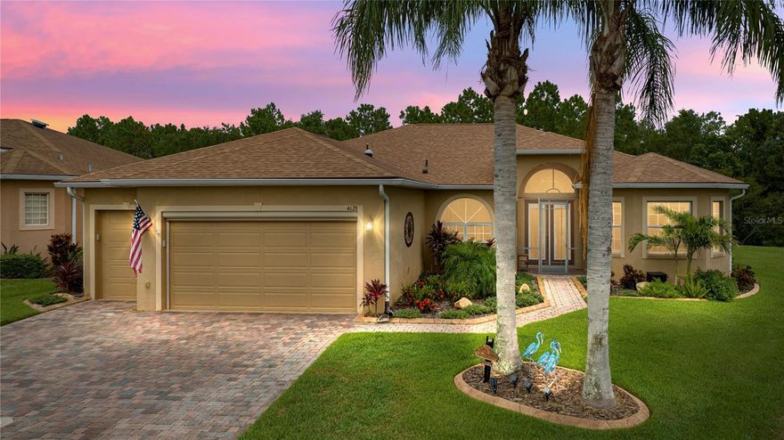 Price Improvement!  This marvelous pool home in Lake Ashton, central Florida’s finest 55+ active-adult community, is a stunning example of beauty and amenities for a personal, private oasis.  Enhancing the curb appeal are stately palm trees, professional landscaping, custom plantings, and custom curbing.  The main garage door is insulated and has an electric, retractable screen.  A golf cart garage is part of the spacious garage area and both garage doors have keyless entry.  A new roof was installed in April 2021 and new air conditioning system in 2017.  Paver drive and walkway.  The front entry is screened and leads to beautiful glass-insert, double front doors with a half-moon window over the transom.
The home’s interior features 18” ceramic tile floors set on the diagonal with carpet in the master bedroom and Luxury Vinyl Plank flooring in the guest bedrooms.  Four sets of 8’ sliding glass doors provide abundant natural light as well as a panoramic view of the lanai, pool, pond, and conservation area beyond.  Two of the sliders have screens for excellent cross ventilation.  All glass sliding doors have new custom blinds.  Living room sliders have a motorized retractable screen that offers great cross ventilation. The kitchen features stunning quartz counters, solid wood cabinets and a new double-oven range and refrigerator.  A large walk-in pantry provides abundant storage. The hot water heater is new, and the home has a Culligan water softener with reverse osmosis.  There are 3 solar tubes for additional, natural light and the interior boasts fresh paint.  One of the guest bedrooms has a built-in combination wall safe.  All house windows have been rescreened and have Plantation Shutters.
At the back of the home – welcome to your personal oasis!  The screen cage has been extended the length of house and measures 64’ x 24’.  The patio was extended from the pool deck north to the house wall and has epoxy flooring. The entire structure was rescreened.  A Paradise Grills outdoor kitchen consisting of 2 – 8’ sections - including grill, rotisserie, griddle, 2 side burners and smoker box was installed.  Each 8’ section has a refrigerator.  Additional electrical outlets were added to the grill side.  The entire outdoor kitchen and two bar stools convey with purchase.  Bluetooth speakers and color changing led lights added.  The grill area has a 20’ retractable, remote-controlled awning with wind sensor and LED lights.  The pool has a 16’ retractable, remote-controlled awning with wind sensor and LED Lights.  The veranda has new paddle fans.  The salt-water pool measures 12’ x 24’ with depth ranging from approximately 3’ to 5’ 6” making it ideal of the grandchildren.  A spa is attached to the pool.  Pool pump and heater are new.  The manual pool cover roller for solar blanket conveys with purchase.  This is an exquisite property!  Schedule your personal showing today!