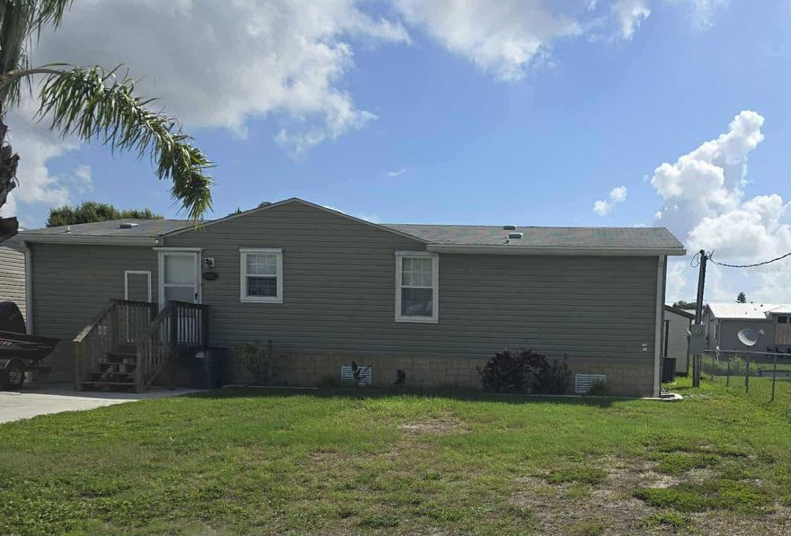 ~Fishermans Paradise~ This charming 3 bedroom/2 bath home is very spacious featuring an open floor plan, crown molding and laminate floors throughout. A HUGE 42X12 Florida room over looking the freshwater canal. Good seawall and a shed for storage. Dock with a fish cleaning table so you can fish in your own backyard. Just minutes from the lock to Beautiful Lake Okeechobee. Call for your appointment today. All measurements are approximate.