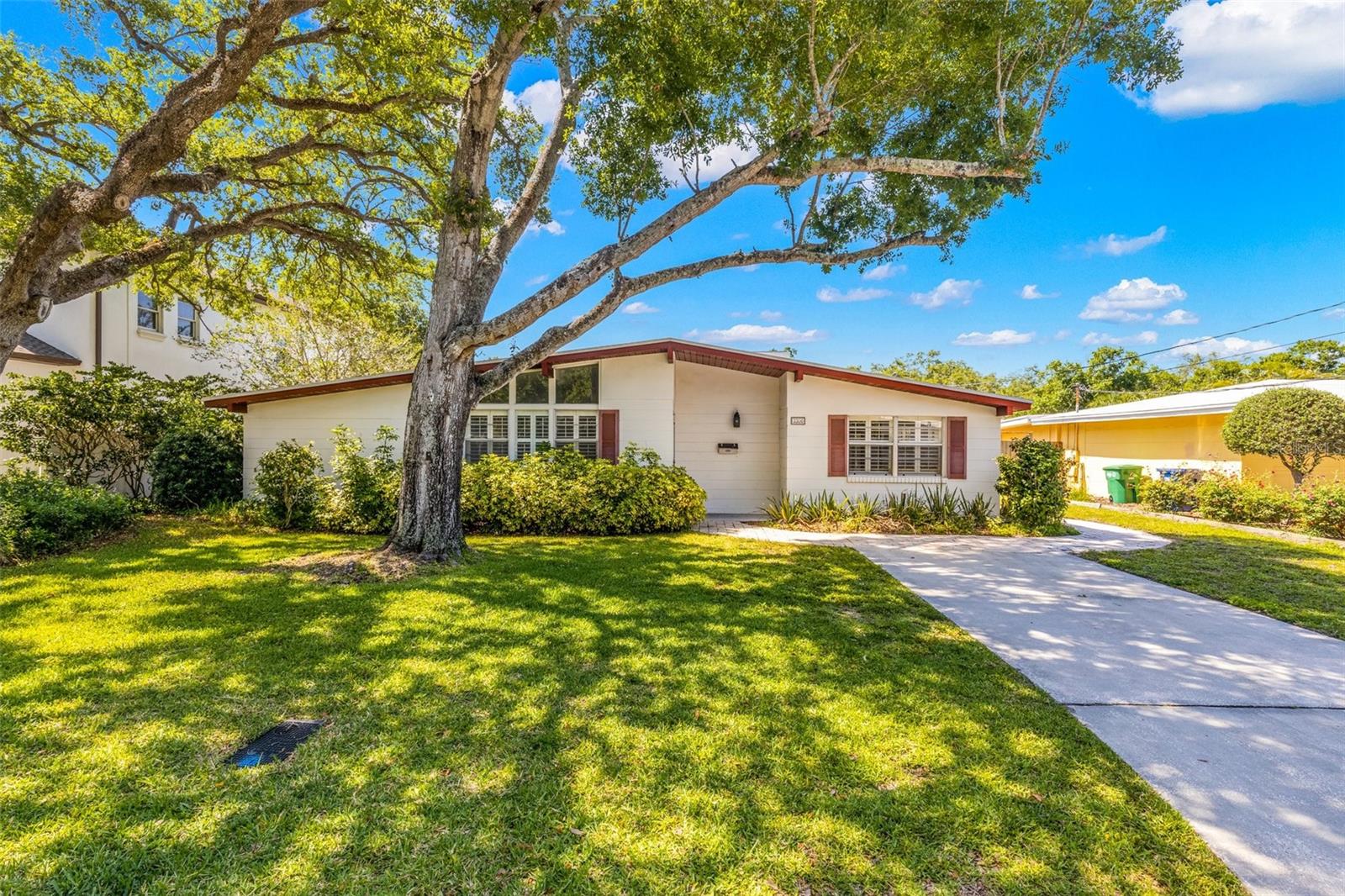Fall in love with this charming, beautifully landscaped, one-story residence located in the heart of South Tampa. This spacious 1,631 sq. ft. home has 3 bedrooms, 2 bathrooms and a versatile bonus room—whether it be a home office, playroom, or a tranquil sanctuary! Step inside to discover a welcoming great room adorned with vaulted ceilings and abundant natural light streaming through multiple windows. The kitchen has undergone a stunning transformation with new appliances, quartz countertops, and wood cabinets. Adjacent, the combined dining and living area offers an ideal space for relaxation and entertainment. Tucked away at the rear of the home, you'll find three serene bedrooms, including a spacious master retreat complete with an ensuite bath. Outside, a screened porch beckons for social gatherings, overlooking an oversized fenced backyard—an idyllic playground for children and pets alike. Boasting plantation shutters, ceramic tile flooring, fresh paint, and a brand-new washer/dryer, this home epitomizes comfort and convenience. With its central location, enjoy easy access to Bayshore Blvd., Hyde Park, Downtown, Tampa International Airport, and MacDill Air Force Base. Don't miss your opportunity of living in this beautiful South Tampa neighborhood—schedule your viewing now!