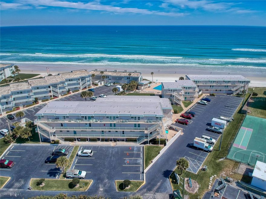 This Stunning and Spacious immaculate & well appointed two story fully furnished Ocean Club South unit is looking for it's next owner. So much to fall in love with here. Situated on the ground floor you will certainly appreciate the Oceanfront Pool views and the ability to walk directly out from your private patio to the pool and non driving beach. You will find plenty of upgrades including a beautiful kitchen with solid stone survce countertops, completely remodeled bathrooms & light fixtures. Featuring two bedrooms 1 bath upstairs and the living room, dining room, kitchen and a full bath downstairs this unit gives amazing beachfront living vibes. The central a/c system was new in 2024. The unit also comes with a full size washer and dryer. Live here full time or enjoy rental income when you can't use it yourself. Schedule your showing today!