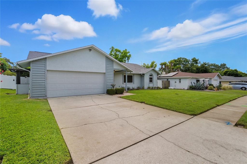 Photo of 1569 Burnham Lane, Dunedin, FL 34698 (MLS # TB8433835)