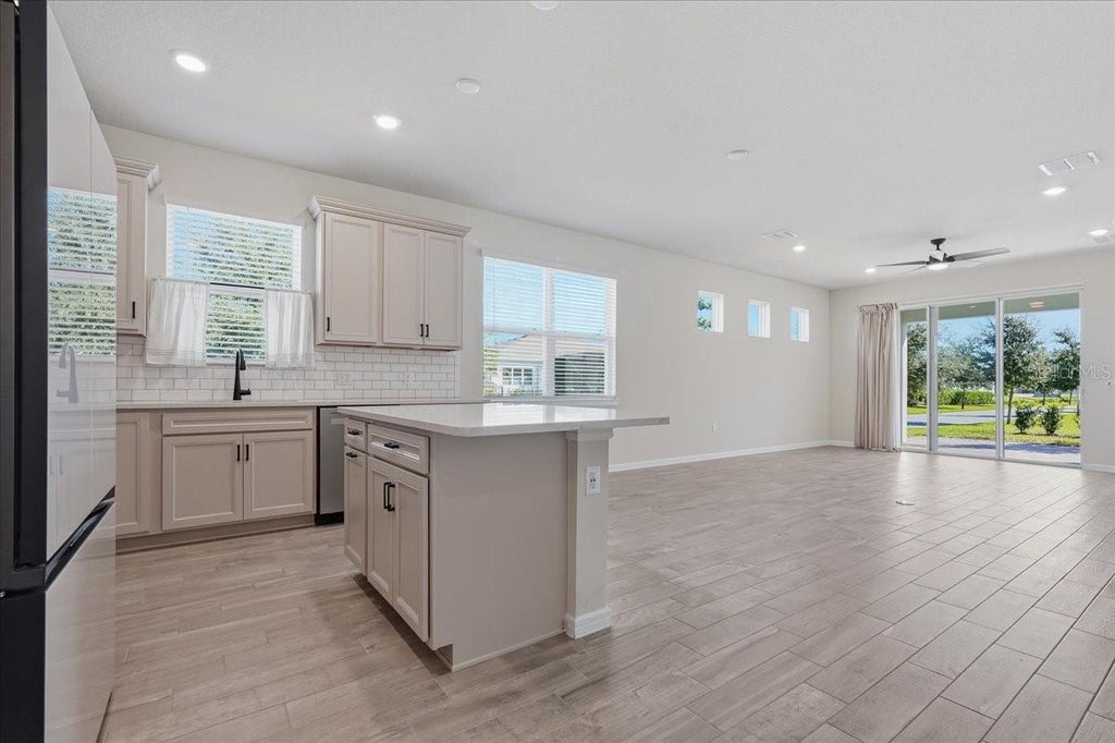 Photo of 13537 Splashing Isla Drive, Winter Garden, FL 34787 (MLS # TB8560424)