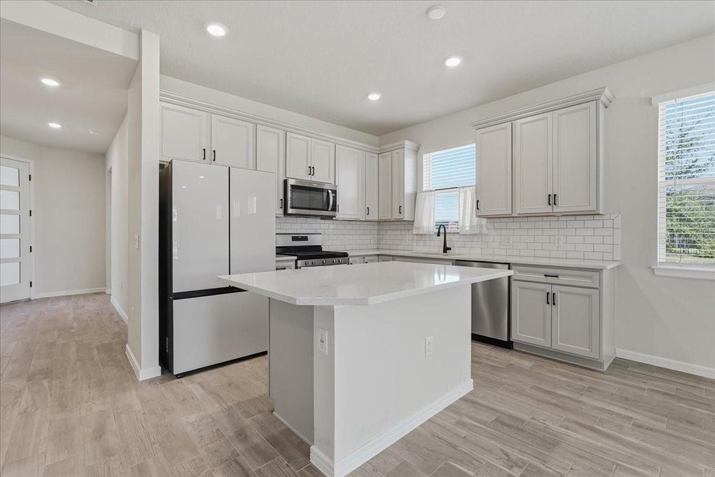 Photo of 13537 Splashing Isla Drive, Winter Garden, FL 34787 (MLS # TB8560424)
